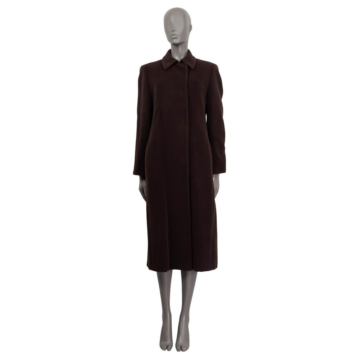100% authentic Akris Punto long sleeve coat in dark brown wool (60%) and angora (40%). Features buttoned cuffs and a slit on the back. Opens with four concealed buttons and a hook on the front. Lined in brown viscose (100%). Has been worn and is in