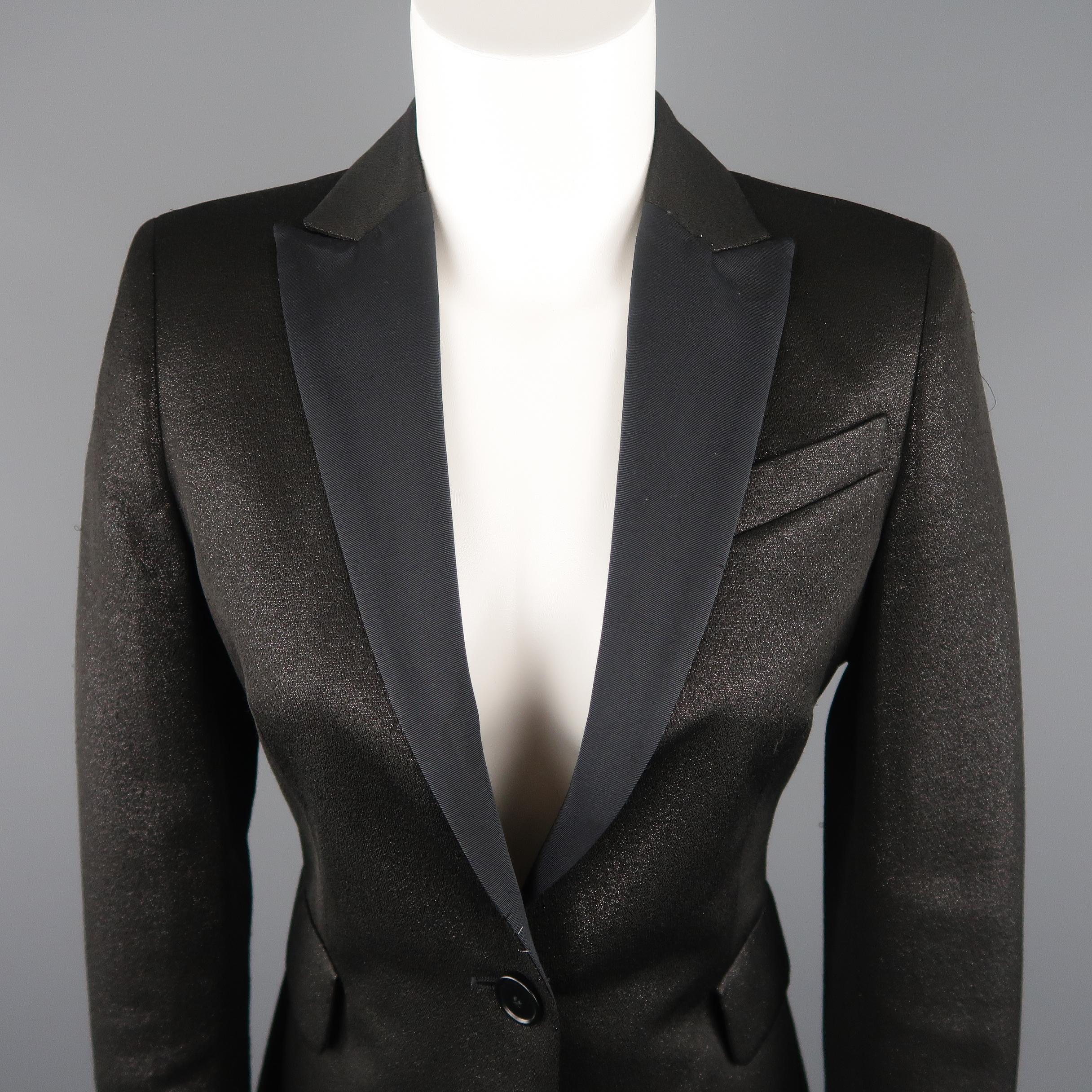 AKRIS tuxedo style jacket comes in a glittery cotton fabric with a single breasted one button closure, half twill peak lapel, and flap pockets. Minor wear throughout and mark on right lapel. As-is. Made in Switzerland. Retail price $ 1,490.00
 
Good