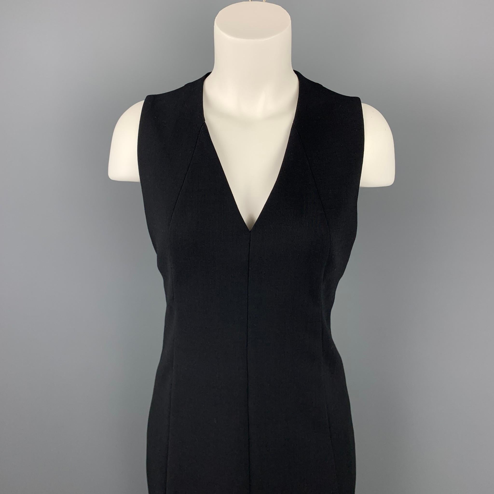 AKRIS dress comes in a black wool / nylon with a silk liner featuring a shift style, v-neck, and a back zip up closure.

Very Good Pre-Owned Condition.
Marked: US 6 / F 38 / D 36
Original Retail Price: $1,990.00

Measurements:

Shoulder: 13 in.