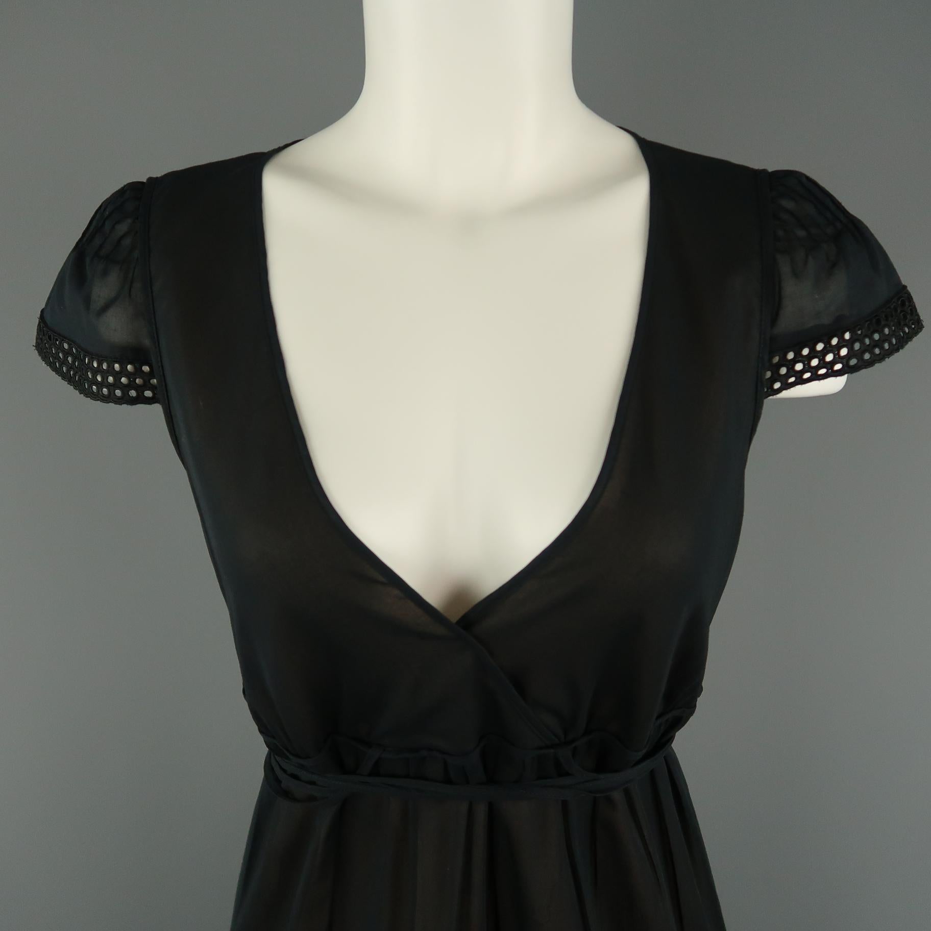 AKRIS peasant style dress comes in sheer black sheer cotton with a wrap V neck, short eyelet lace trimmed sleeves, and tiered A line skirt with wrap tie belt. Made in Switzerland.
 
Very Good Pre-Owned Condition.
Marked: 8
 
Measurements:
