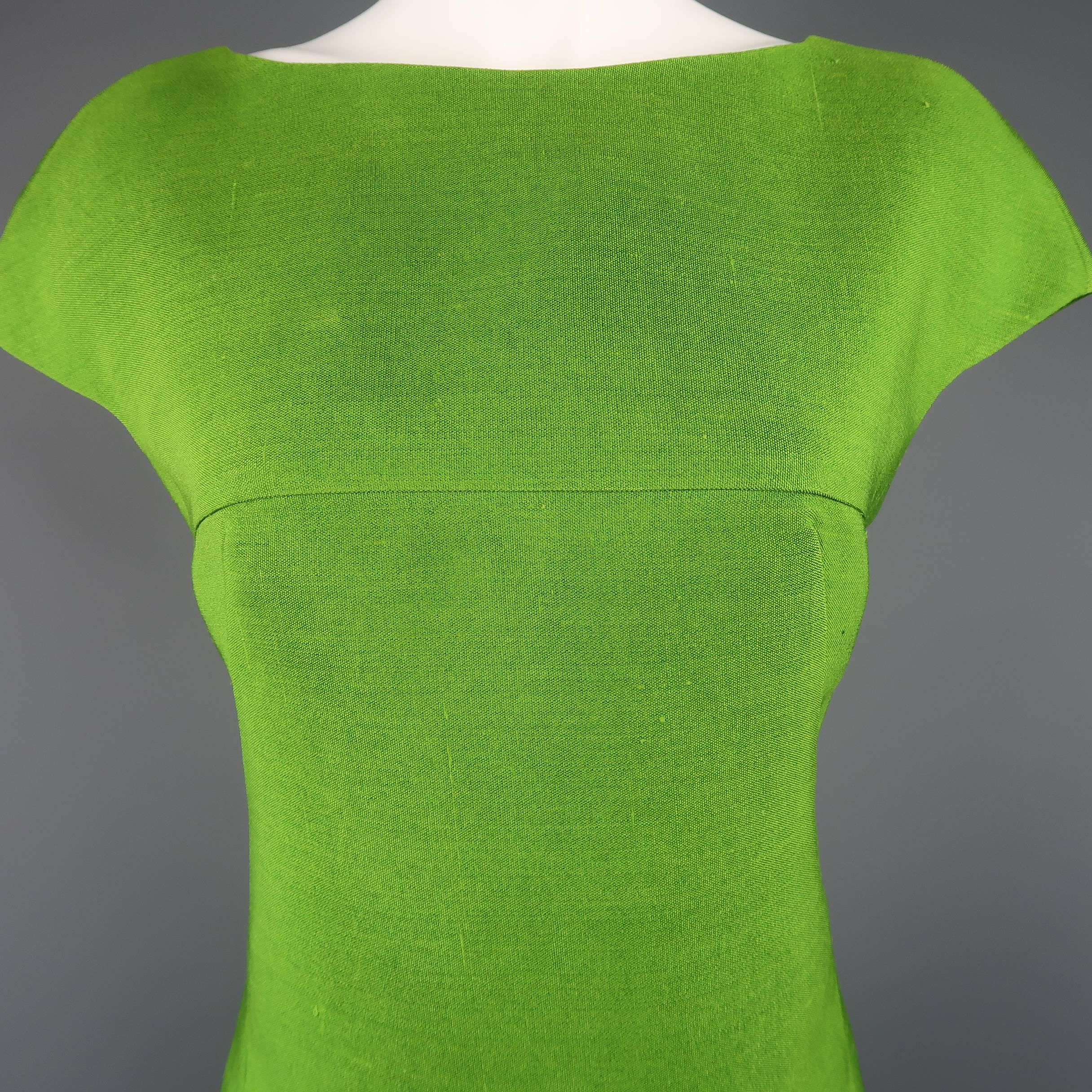 AKRIS shift dress comes in bold green silk canvas and features a high boat neck front, cap sleeves, and crossed V back. Looks great backwards as well. Made in Switzerland.
 
Good Pre-Owned Condition.
Marked: 8
 
Measurements:
 
Shoulder: 17