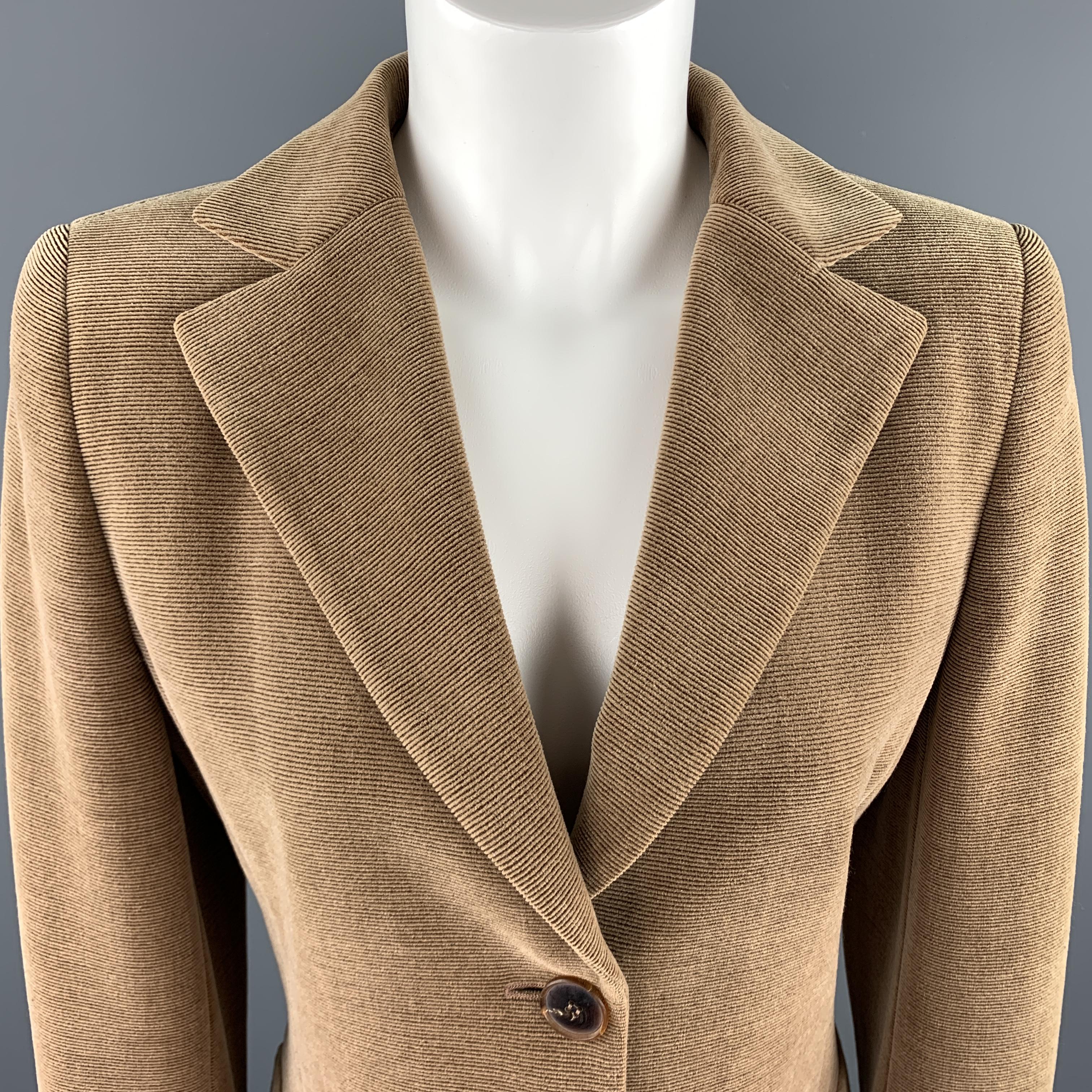 AKRIS blazer comes in tan wool blend corduroy with a notch lapel, single breasted two button font, and ventless back. Made in Switzerland.

Very Good Pre-Owned Condition.
Marked: US 8

Measurements:

Shoulder: 18 in.
Bust: 36 in.
Sleeve: 24