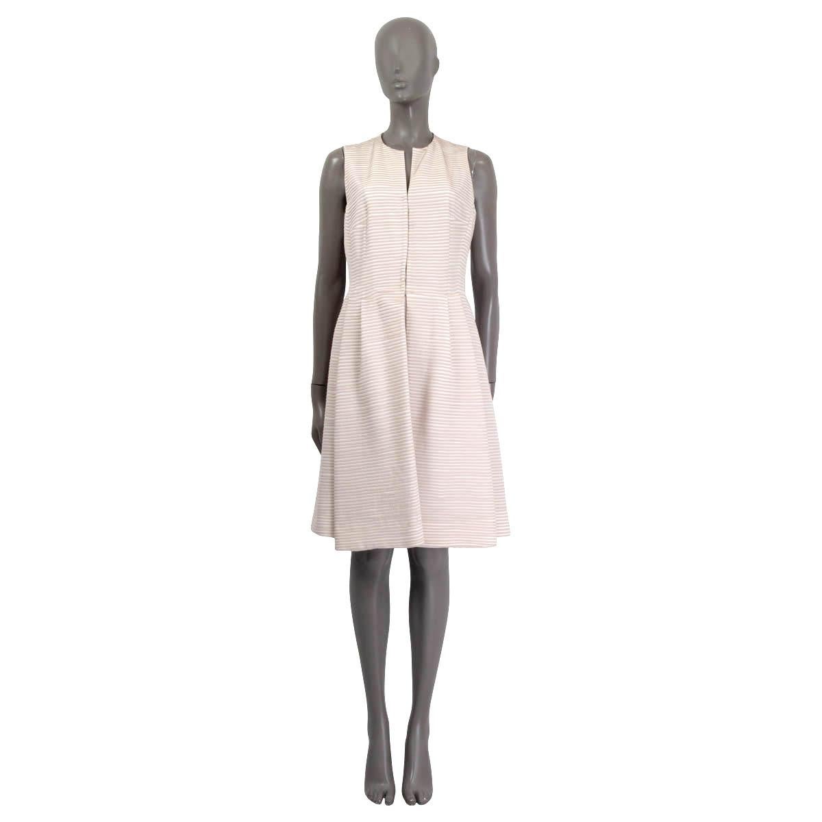 100% authentic Akris sleeveless striped wrap dress in white and dusty rose silk (100%). Features a v-neck and a slit on the front. Opens with concealed buttons and hooks on the front. Lined in white viscose (100%). Has been worn and is in excellent