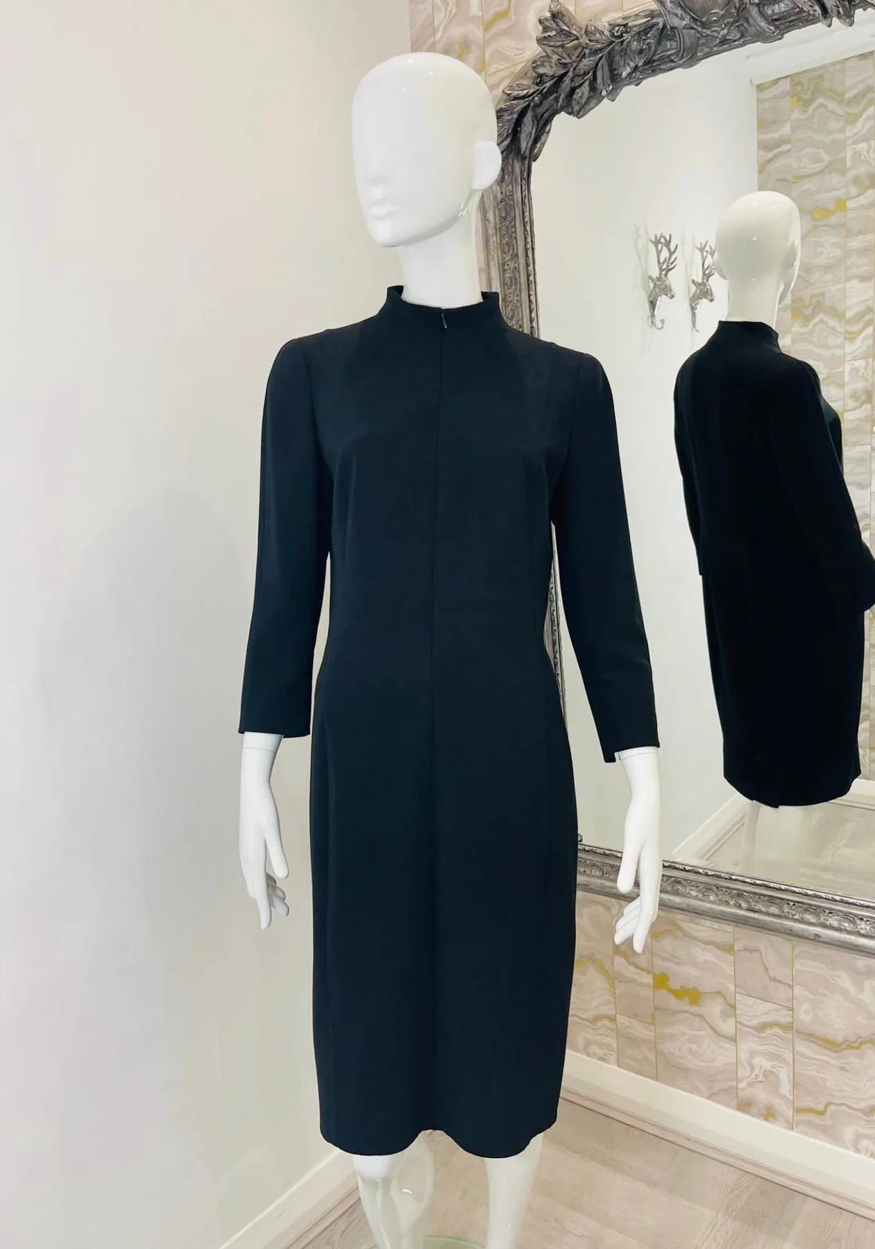Akris Wool Dress

Black dress with high neck, vented 3/4 sleeves and zipper to the front.

Additional information:
Size – 42FR
Composition – 99% Wool, Lining 90% Silk 
Condition – Very Good