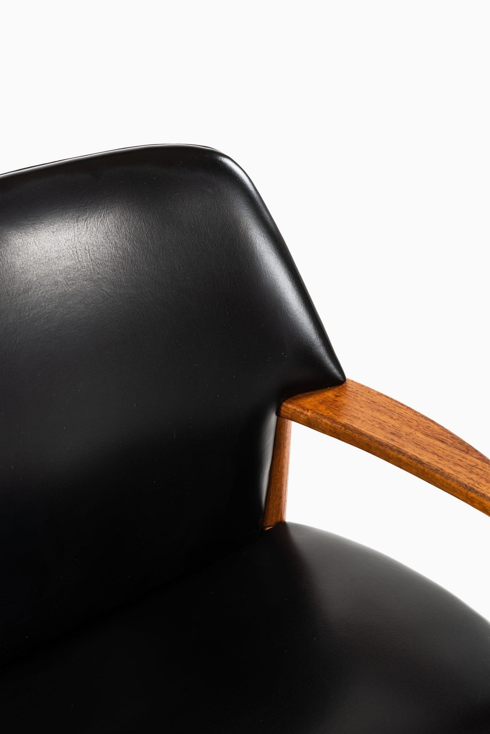 Rare pair of armchairs designed by Aksel Bender Madsen & Ejner Larsen. Produced by Fritz Hansen in Denmark.