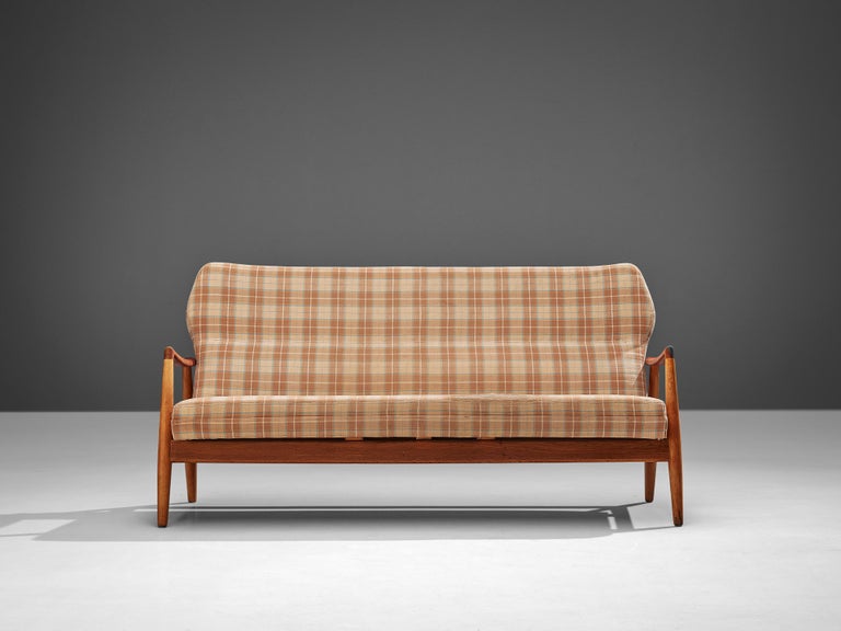 Aksel Bender Madsen, sofa, fabric, oak, teak, Denmark, 1960s 

The designer of this sofa is Aksel bender Madsen (1916-2000) who is known for his classic Mid-Century designs and worked with prominent Danish designers such as Kaare Klint (1888-1954),