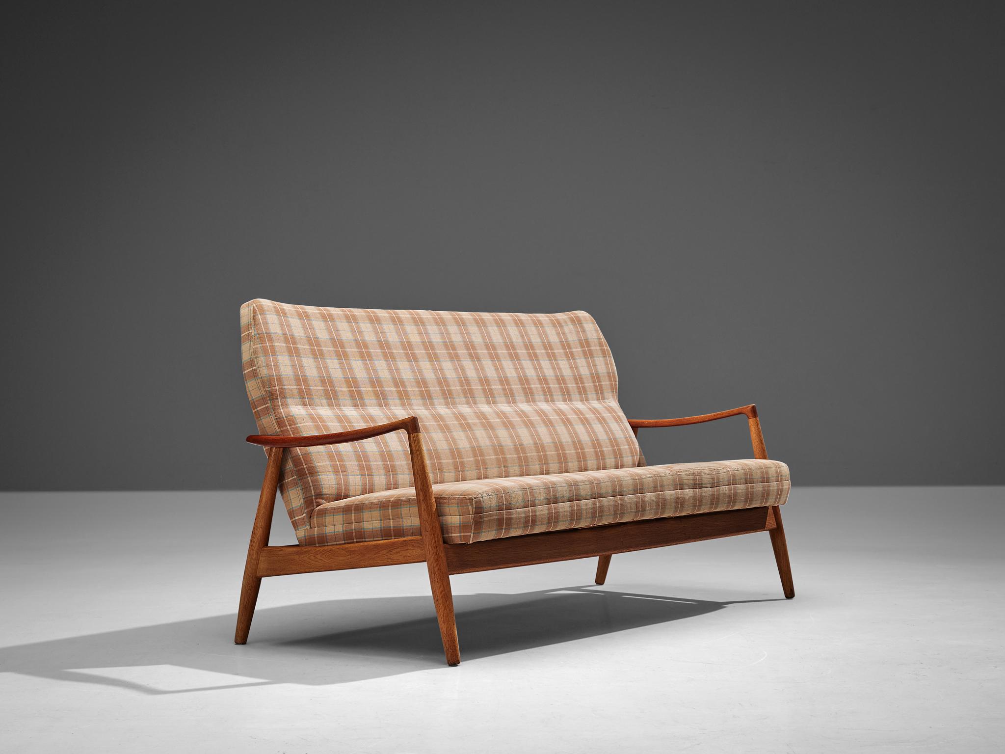 Aksel Bender Madsen, sofa, fabric, oak, teak, Denmark, 1960s 

The designer of this sofa is Aksel bender Madsen (1916-2000) who is known for his classic Mid-Century designs and worked with prominent Danish designers such as Kaare Klint (1888-1954),