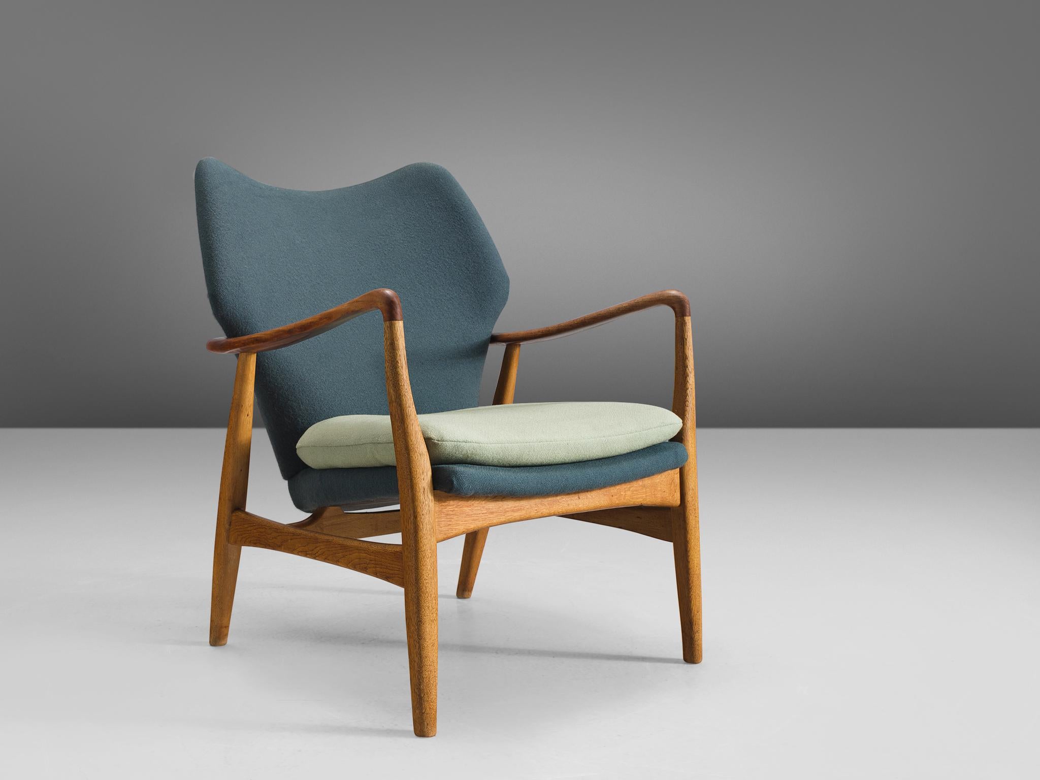 Aksel Bender Madsen for Bovenkamp, oak and teak and turquoise and light green fabric, Denmark, 1950s.

This lady lounge chair by Madsen is executed by Bovenkamp. Madsen is known for his modest, Minimalist designs that are often executed in teak or