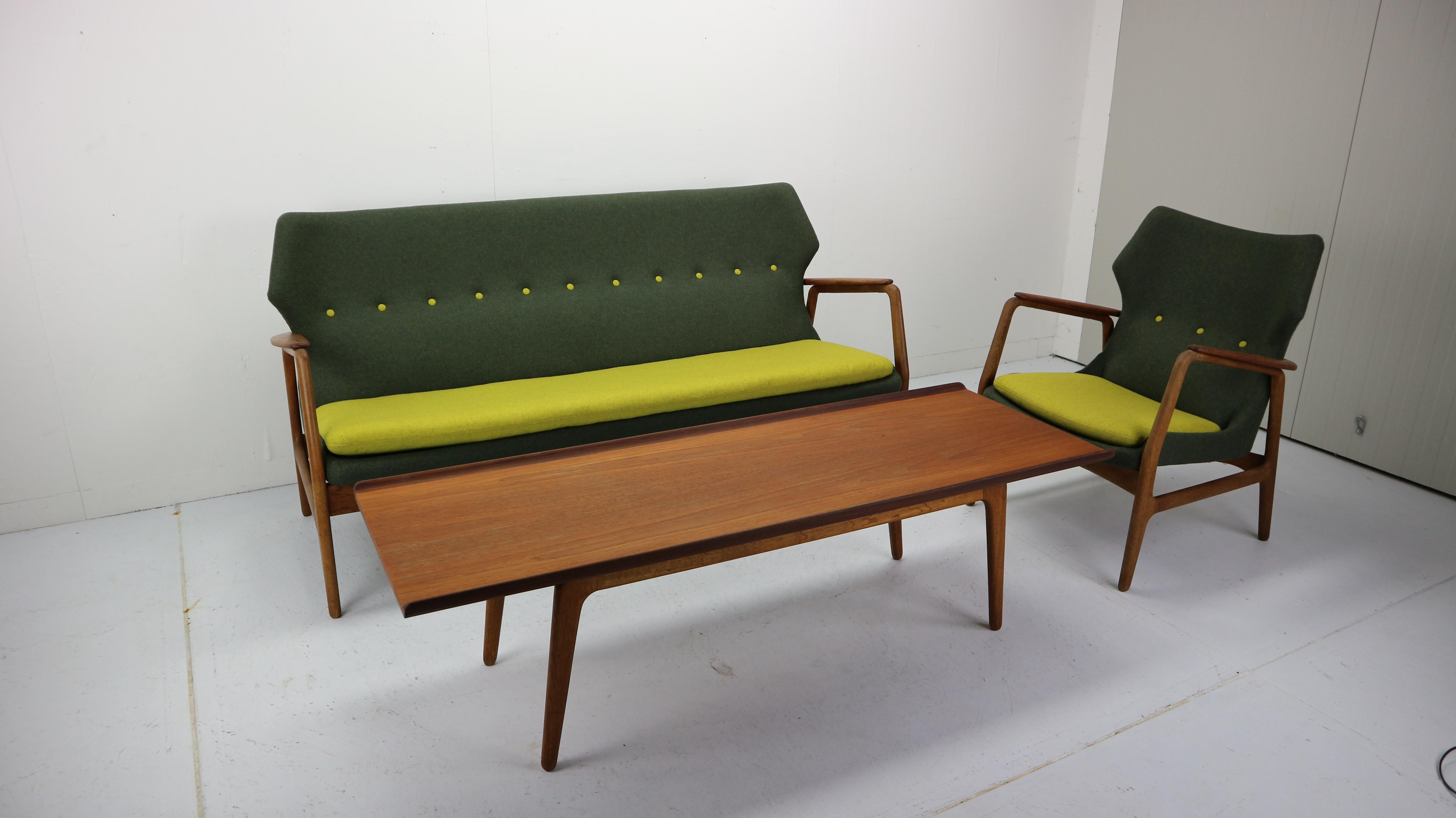 This sitting group consists of a wingback 3-seater, lounge chair and matching table. Designed by Aksel Bender Madsen. Aksel Bender Madsen worked for Bovenkamp in the 1950s and 1960s, this set was produced in 1958. Madsen helped Bovenkamp to