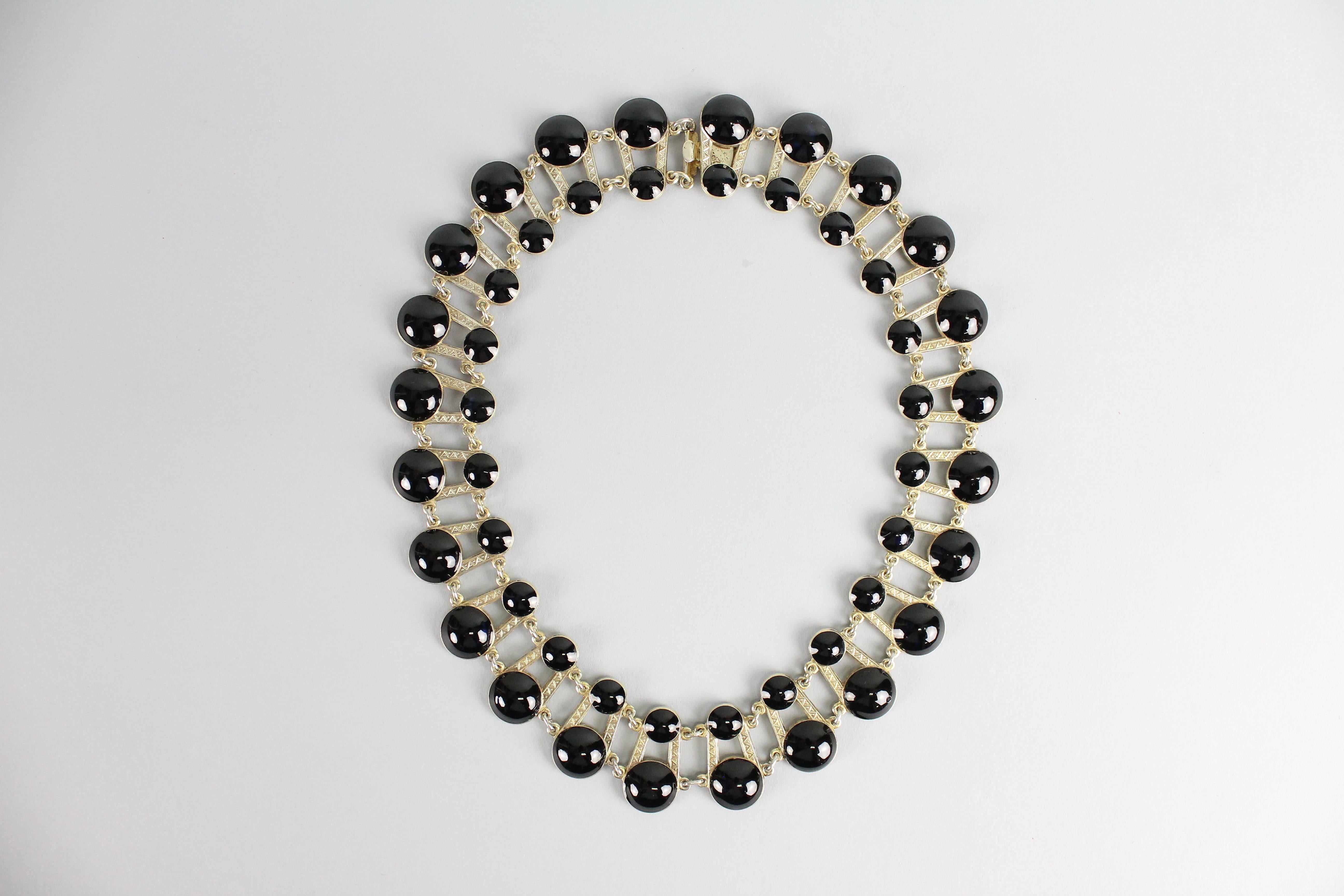Very nice necklace by Aksel Holmsen, Norway.
Made in gilt sterling silver and black enamel.
Great condition, no issues!