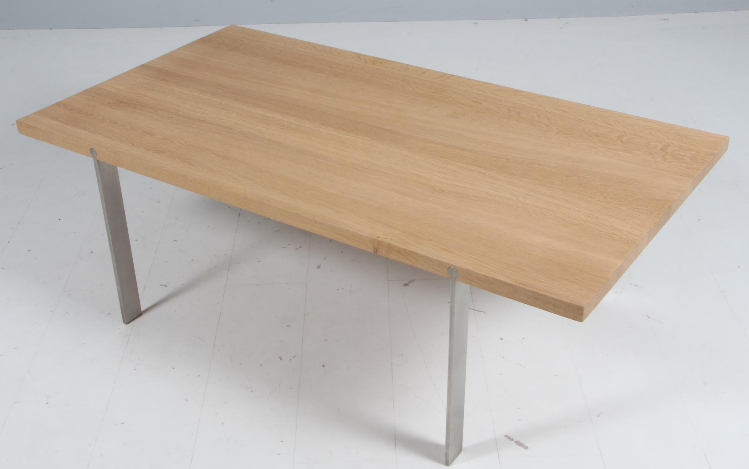 Aksel Kjersgaard coffee table in solid soap treated oak. Base of stainless steel.

Made by Naver.