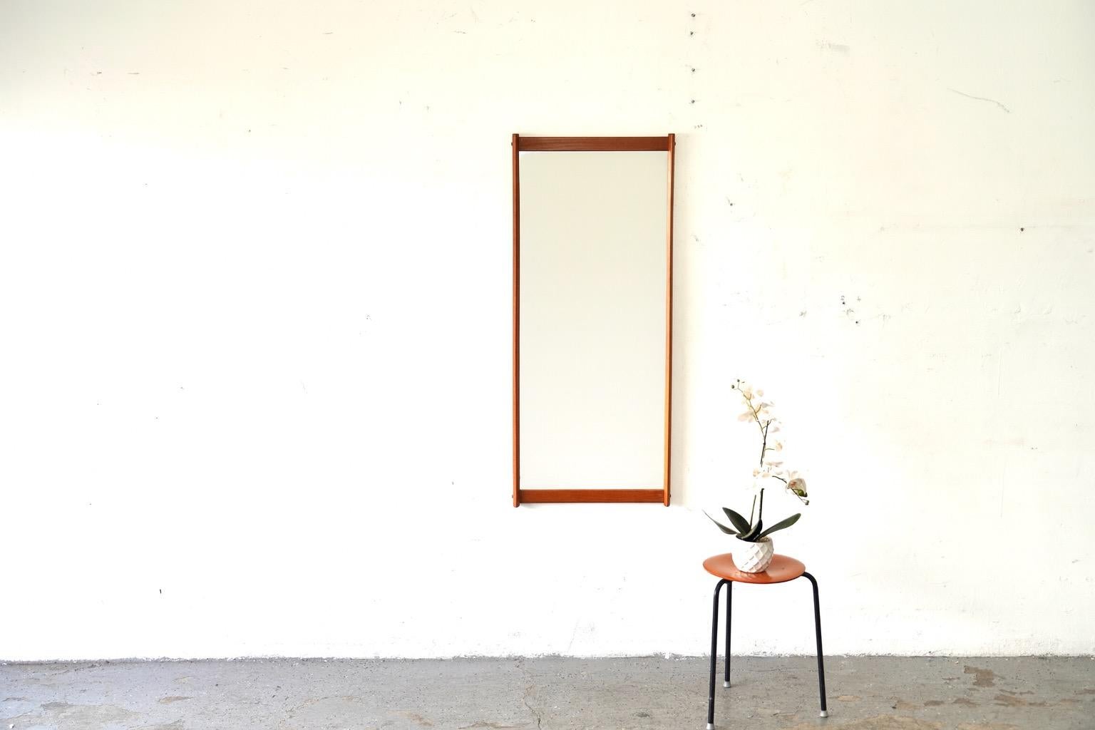 A stunning example of Danish modern design, this Model 220 mirror by Aksel Kjersgaard Odder showcases the timeless simplicity and craftsmanship for which Kjersgaard is celebrated.
Expertly crafted in solid teak, the mirror features clean lines, soft