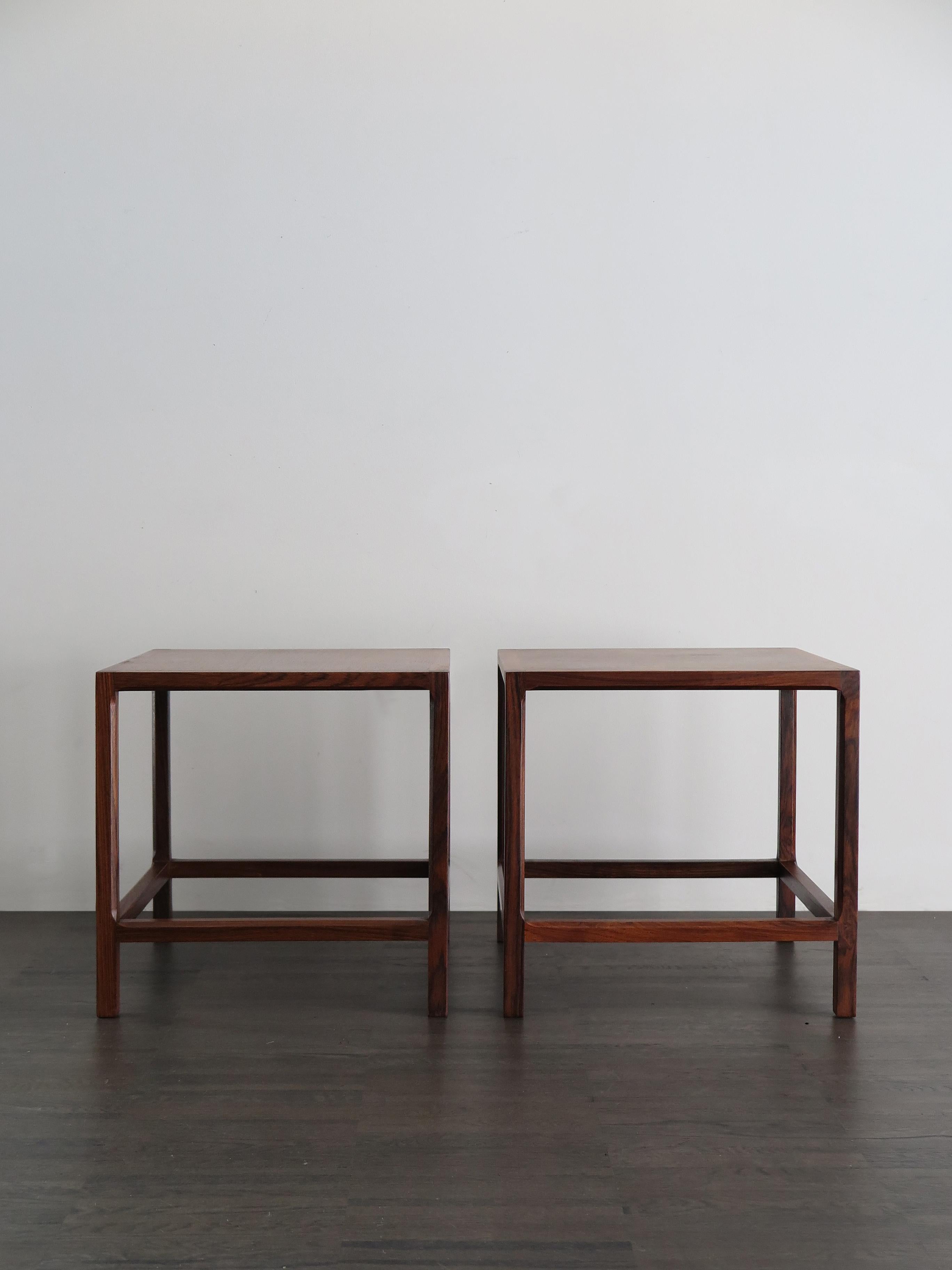 Scandinavian Mid-Century Modern design dark wood nightstands or coffee tables produced by Aksel Kjersgaar, Denmark, circa 1950.

Please note that the items are original of the period and this shows normal signs of age and use.