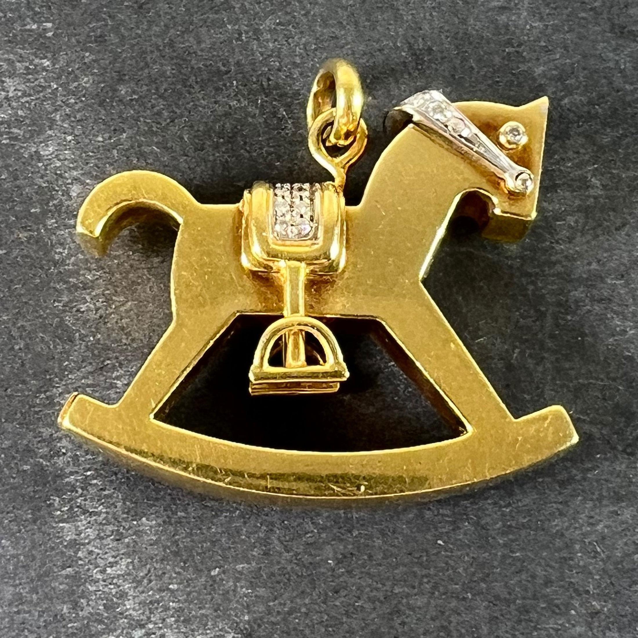 A large vintage Italian 18 karat (18K) yellow gold pendant designed as a rocking horse with a movable white gold bridle by Al Angiolino & Zogno. The saddle, bridle and eyes are set with 29 round brilliant cut diamonds. Marked 750 for 18 karat gold