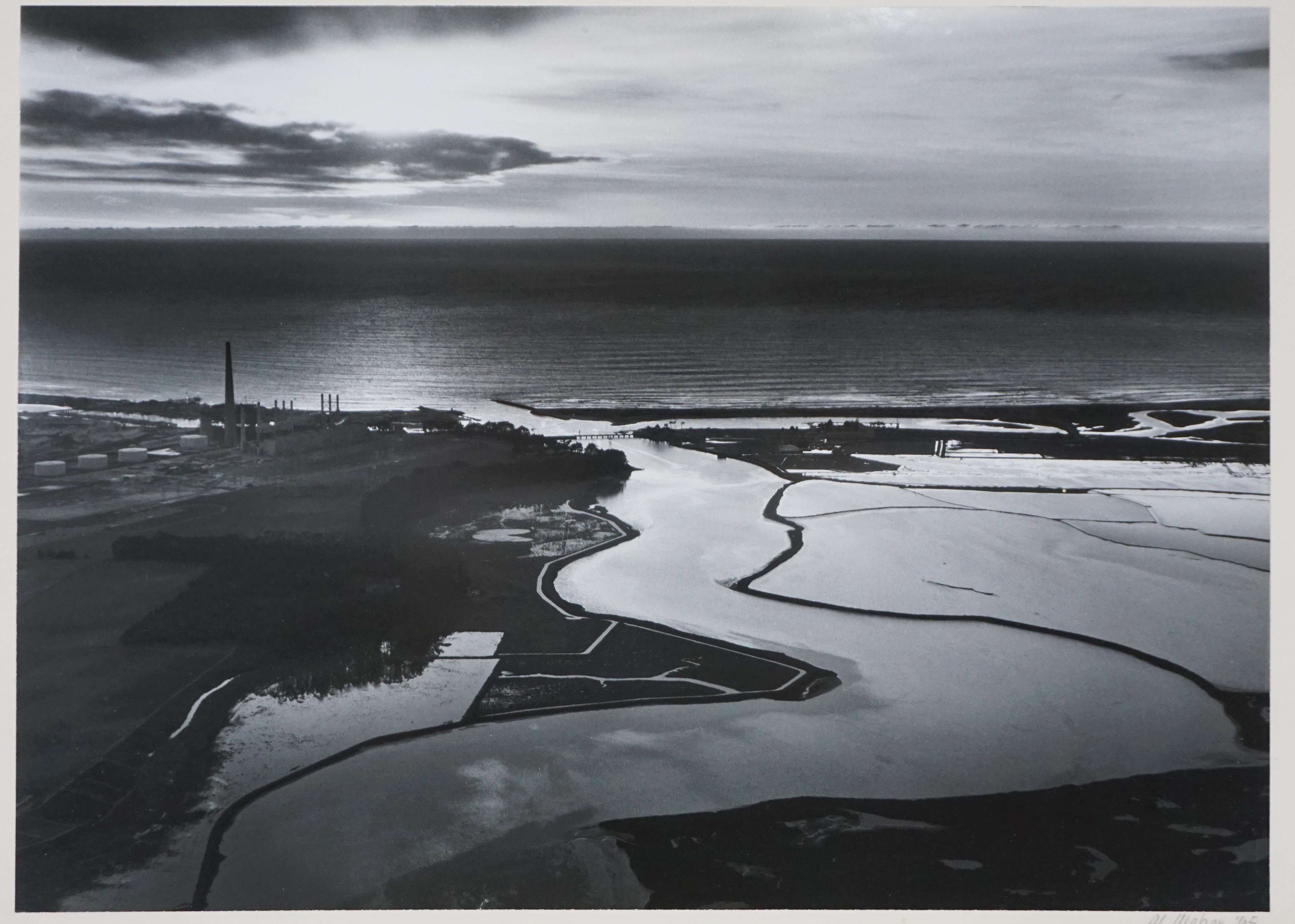Moss Landing - 1965 Original Black and White Photograph

Original black and white photograph of Moss Landing in 1965 by Al Weber (American, 1930-2016). The photograph shows Moss Landing and the Monterey Bay peninsula with the power plant seen to the