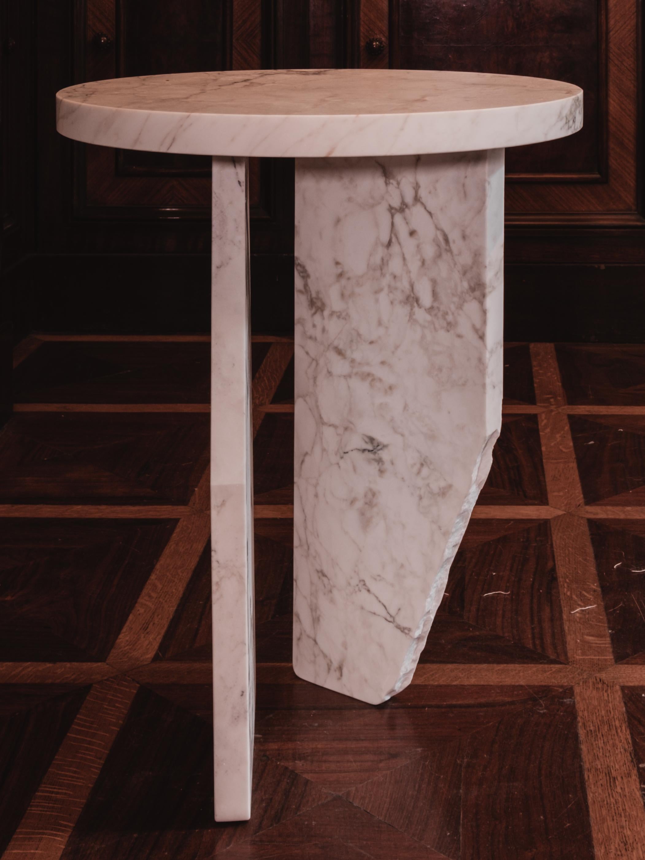 Ala Cocktail table by Karu
Dimensions: Ø 40 x H 50 cm.
Materials: Handcrafted Calacatta gold marble.
*Price is just for the table.

Calacatta Gold Marble from the Cathedrals of Carrara, Italy. Exposed edges reveal the stone’s character, carved