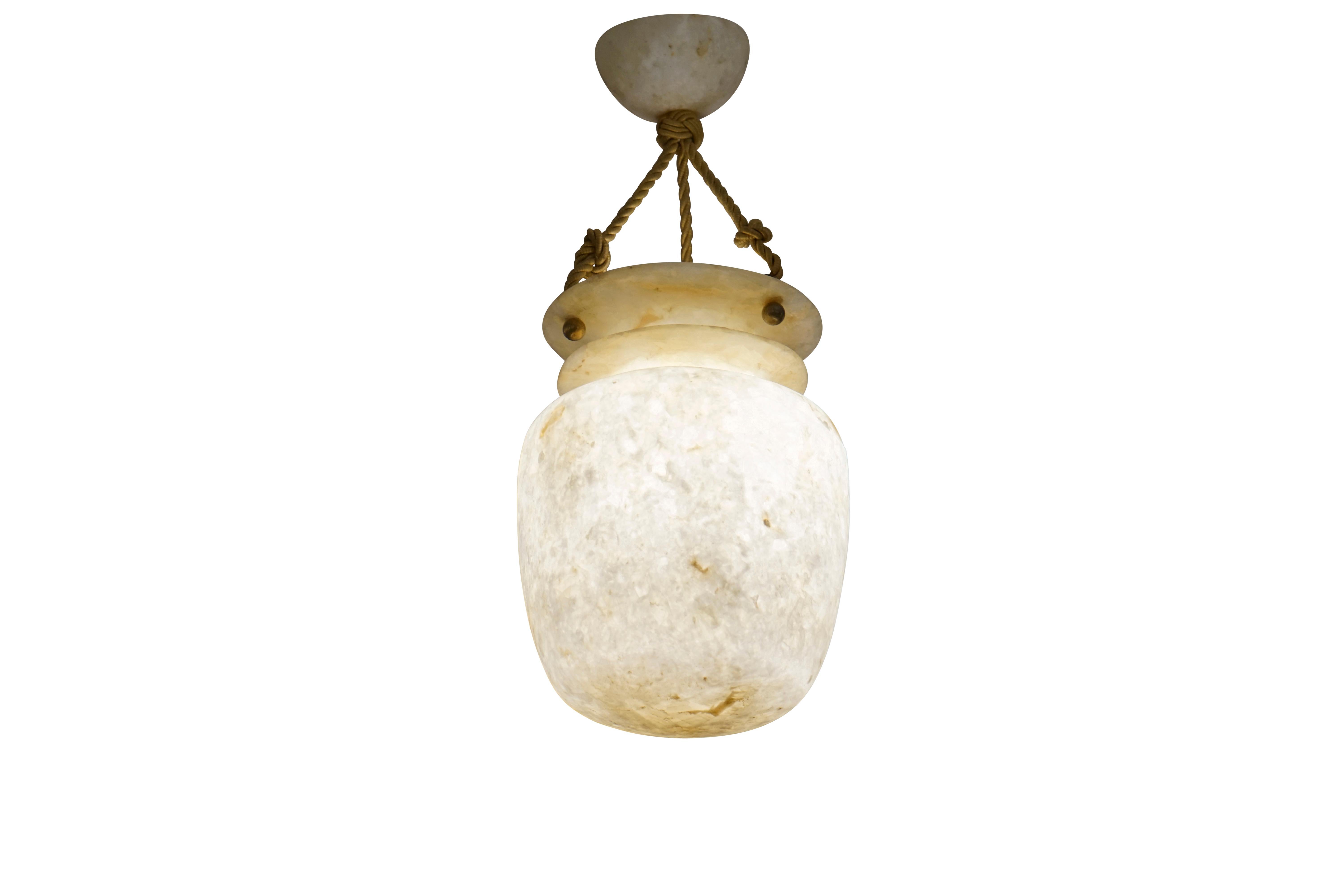 A petite fixture carved from a rare, unveined yet rustic type of alabaster, the fixture is a stylized Amphora with a single band encircling the 