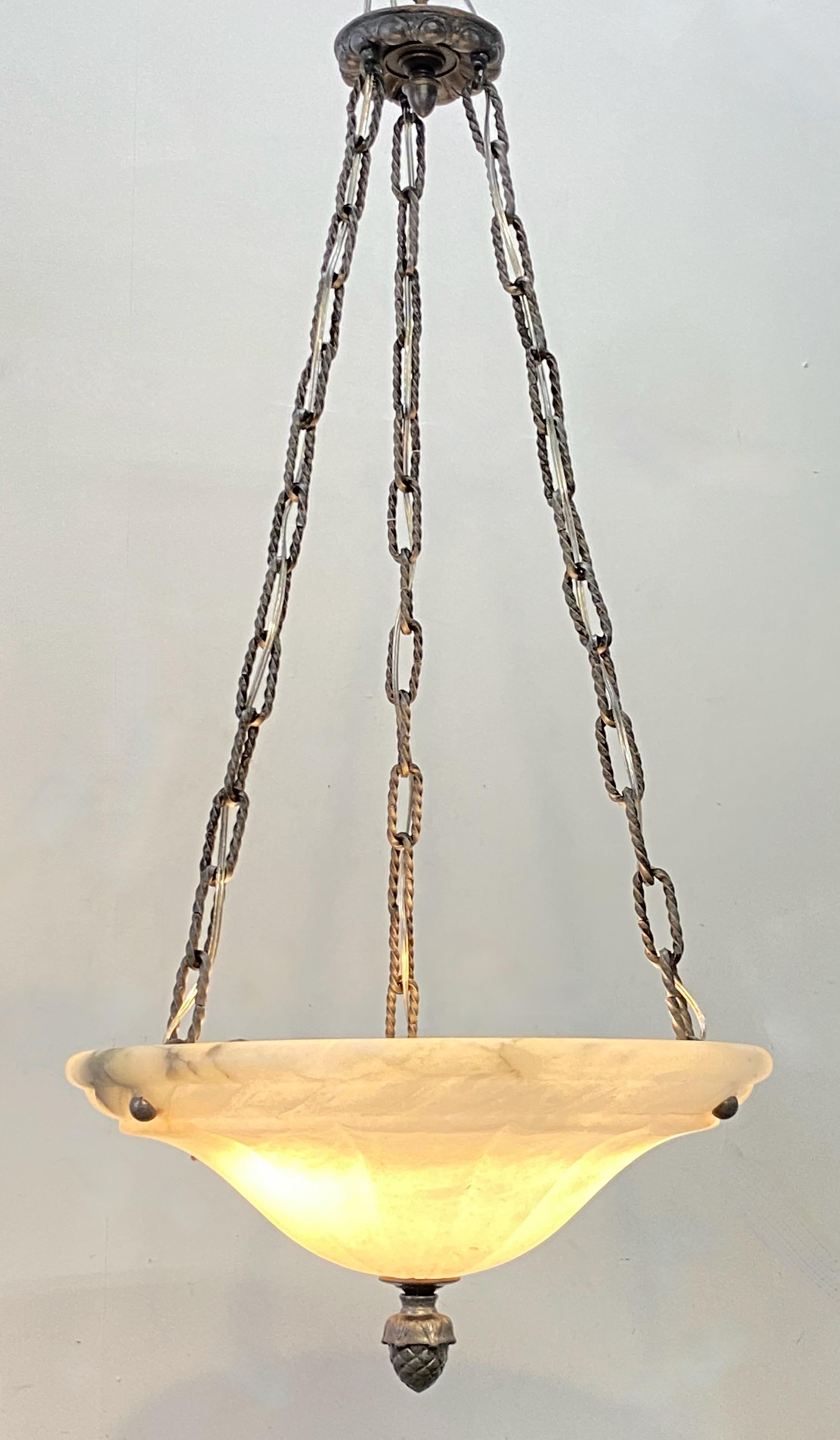 Elegant pendant shaped carved alabaster light fixture with brass hardware.
Recently re-wired and ready to install. We can adjust the the chain measurement to buyers specification.
We have two available, for a matched pair. Sold separately.
20th