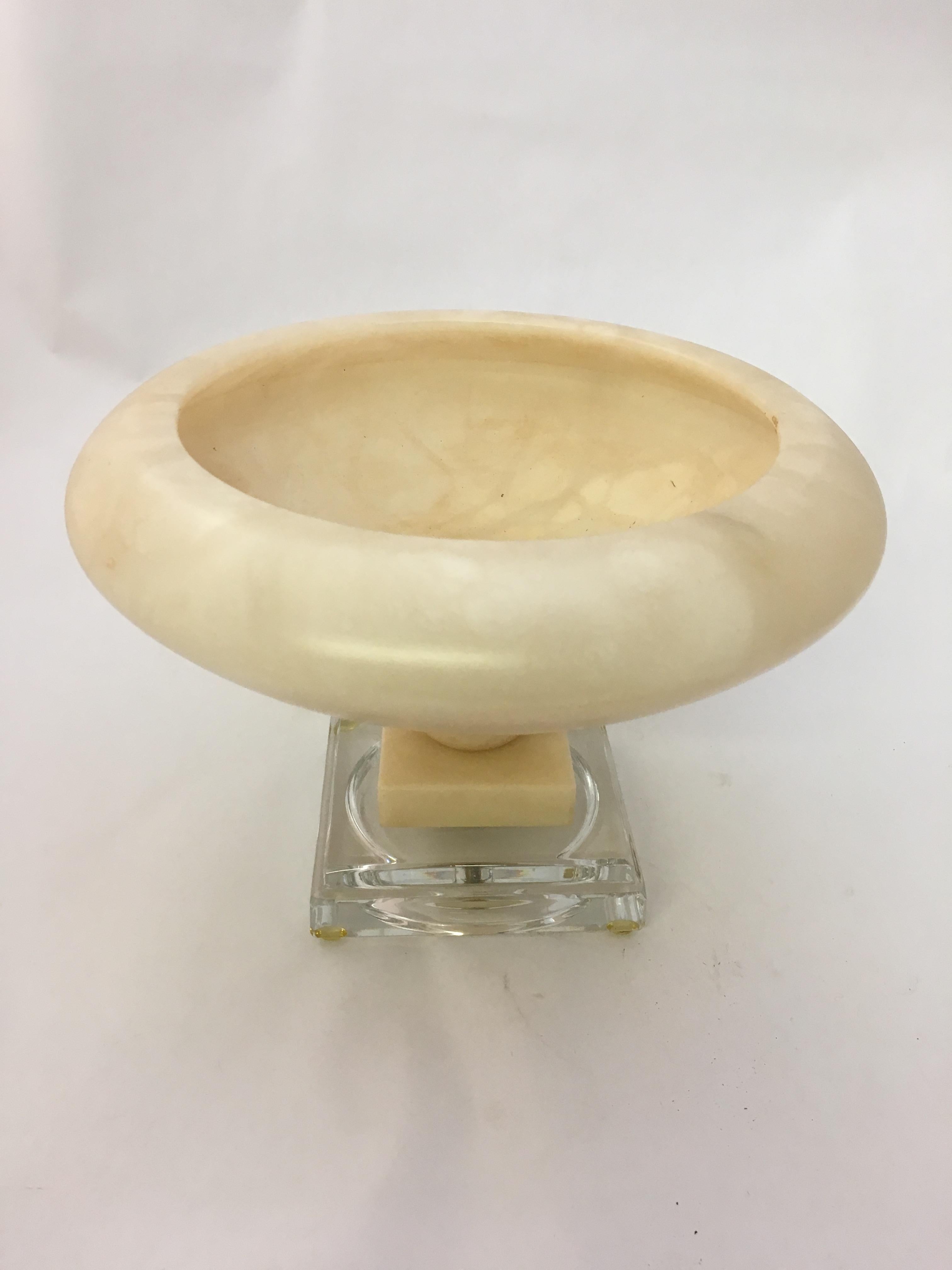 Polished alabaster with a clear Lucite base, circa 1980. A beautiful decorative object. Very good condition.

Measures: 10.5