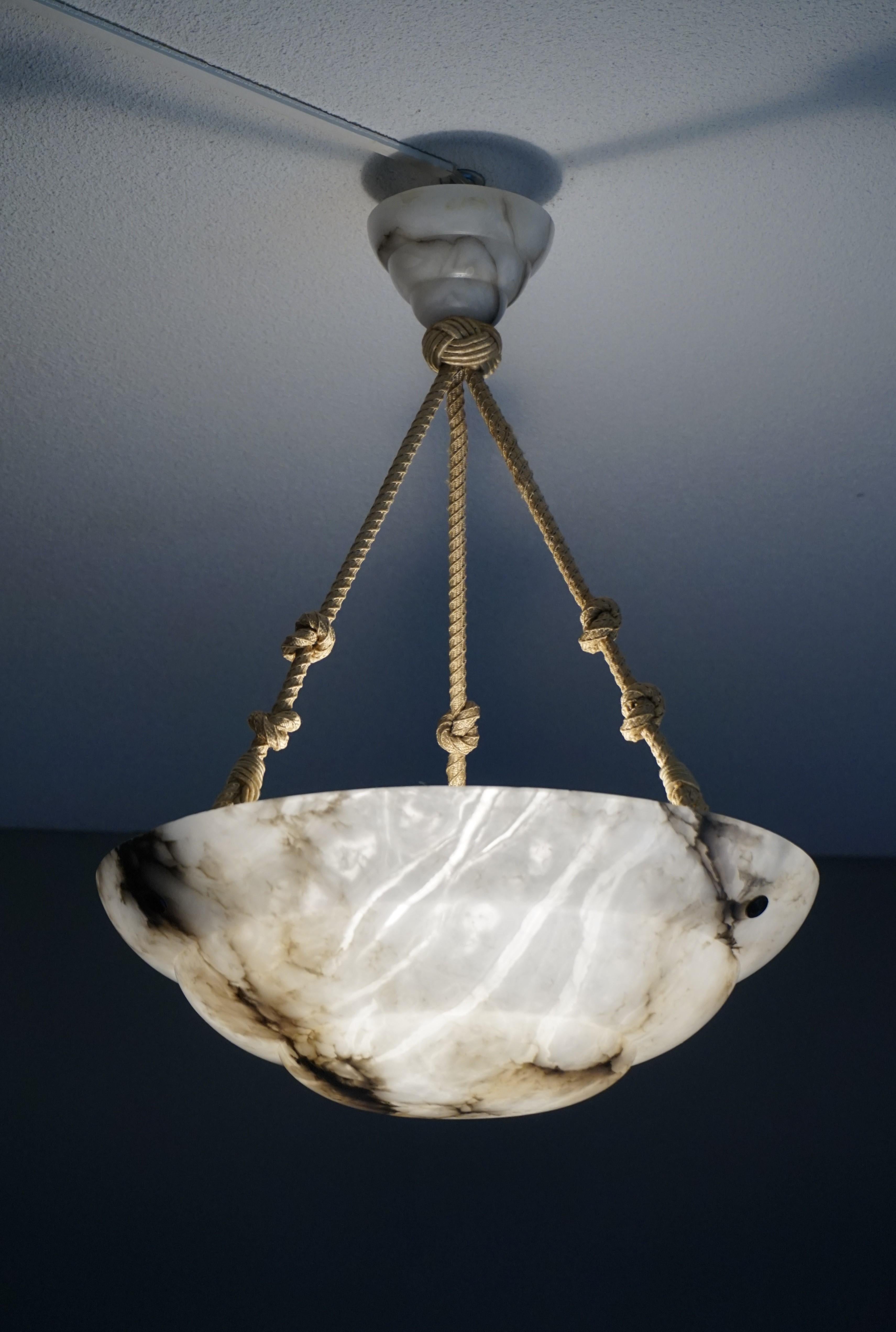 Stunning black and white alabaster chandelier.

This practical size, perfect height and excellent condition Art Deco pendant could not be more original. Every piece, from the alabaster canopy down to the excellent Art Deco shade is exactly like it