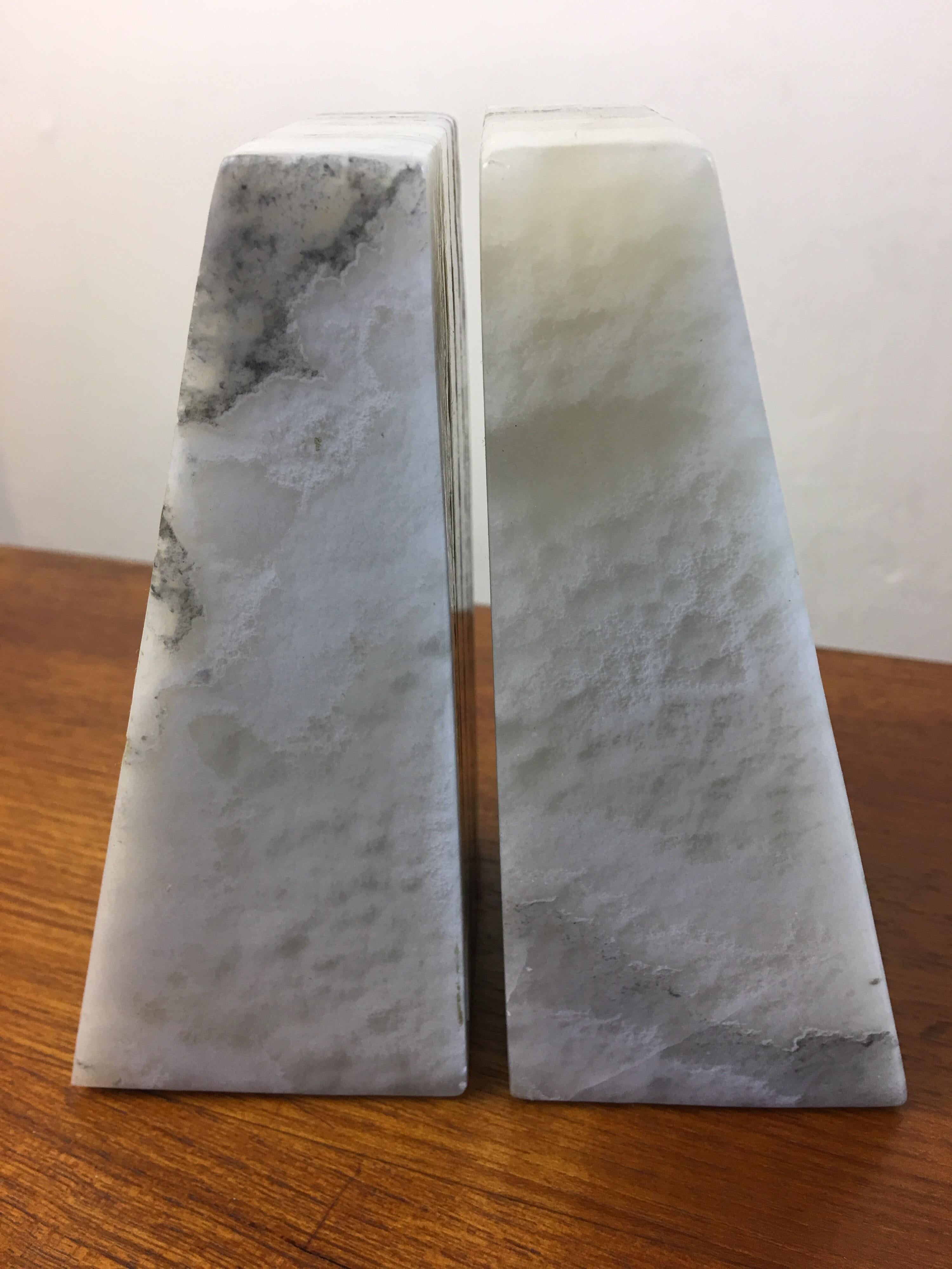 Alabaster bookends in an ivory stone. Wedge shaped!