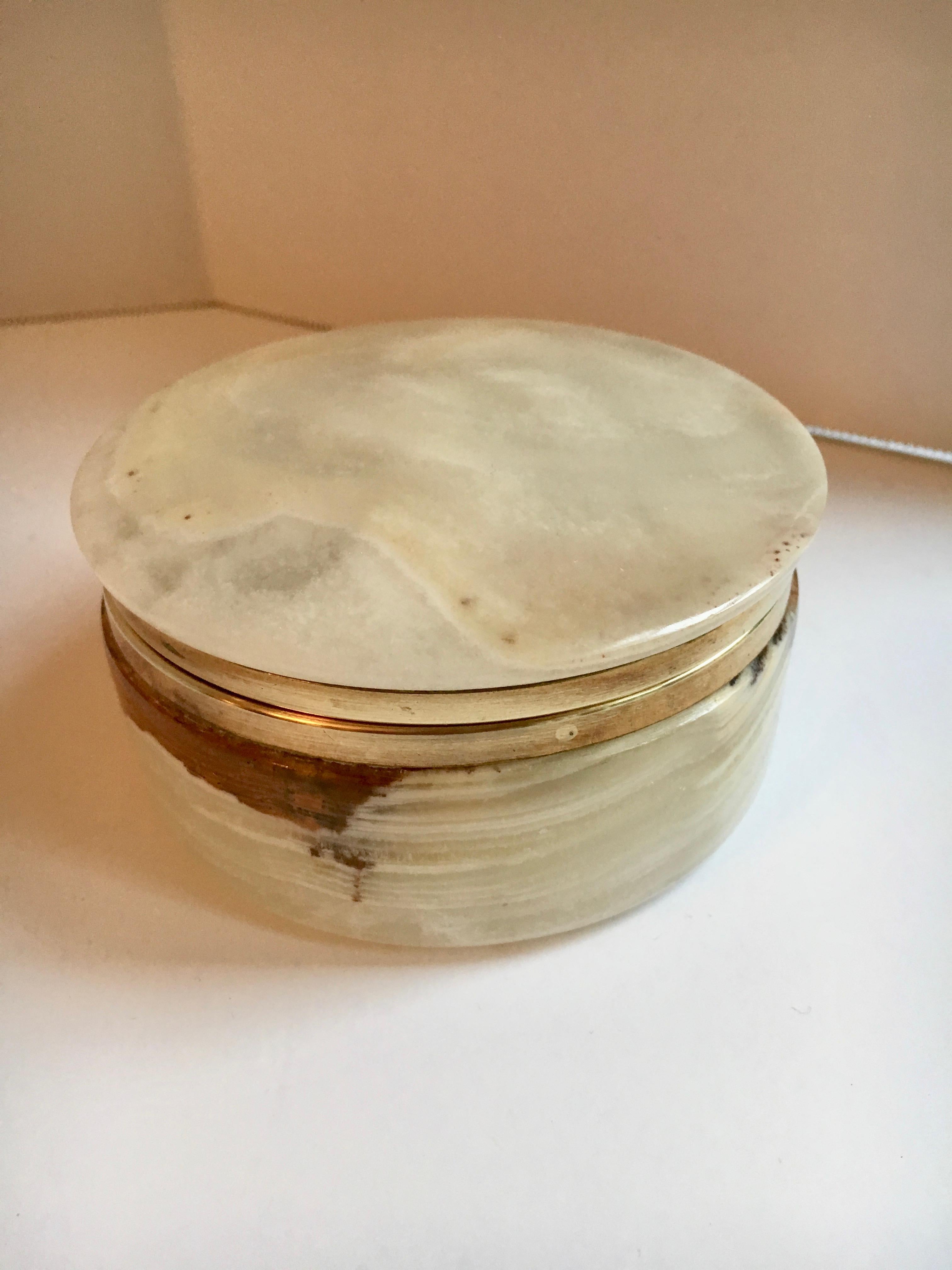 A handsome round Alabaster box suitable for anything from jewelry to men’s pieces or paper clips!