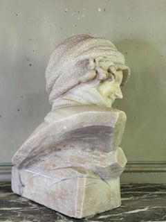 Alabaster bust of a young girl wearing a turtleneck, signed Caloni, Italy, circa