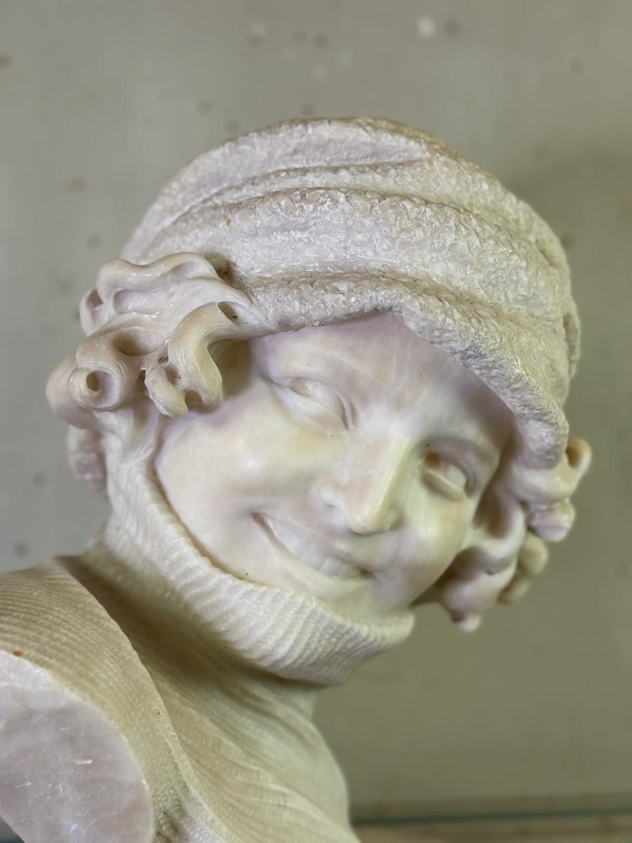 Classical Greek Alabaster bust of a young girl wearing a turtleneck, signed Caloni, Italy, circa For Sale