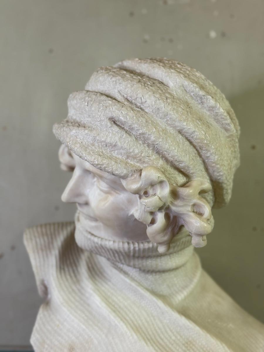Marble Alabaster bust of a young girl wearing a turtleneck, signed Caloni, Italy, circa For Sale