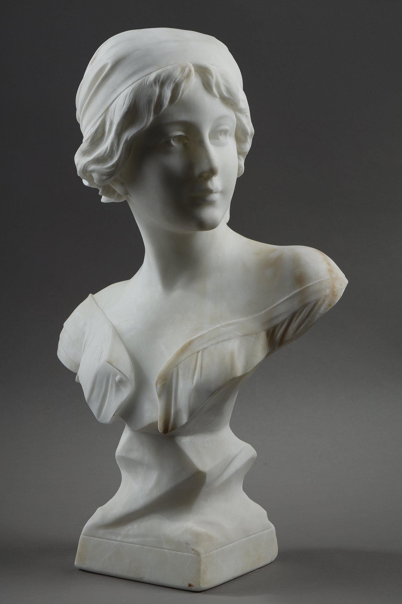 Alabaster sculpture of a bust of a young woman with her hair held in a kerchief. Signed on the back: A. Cyprien.

