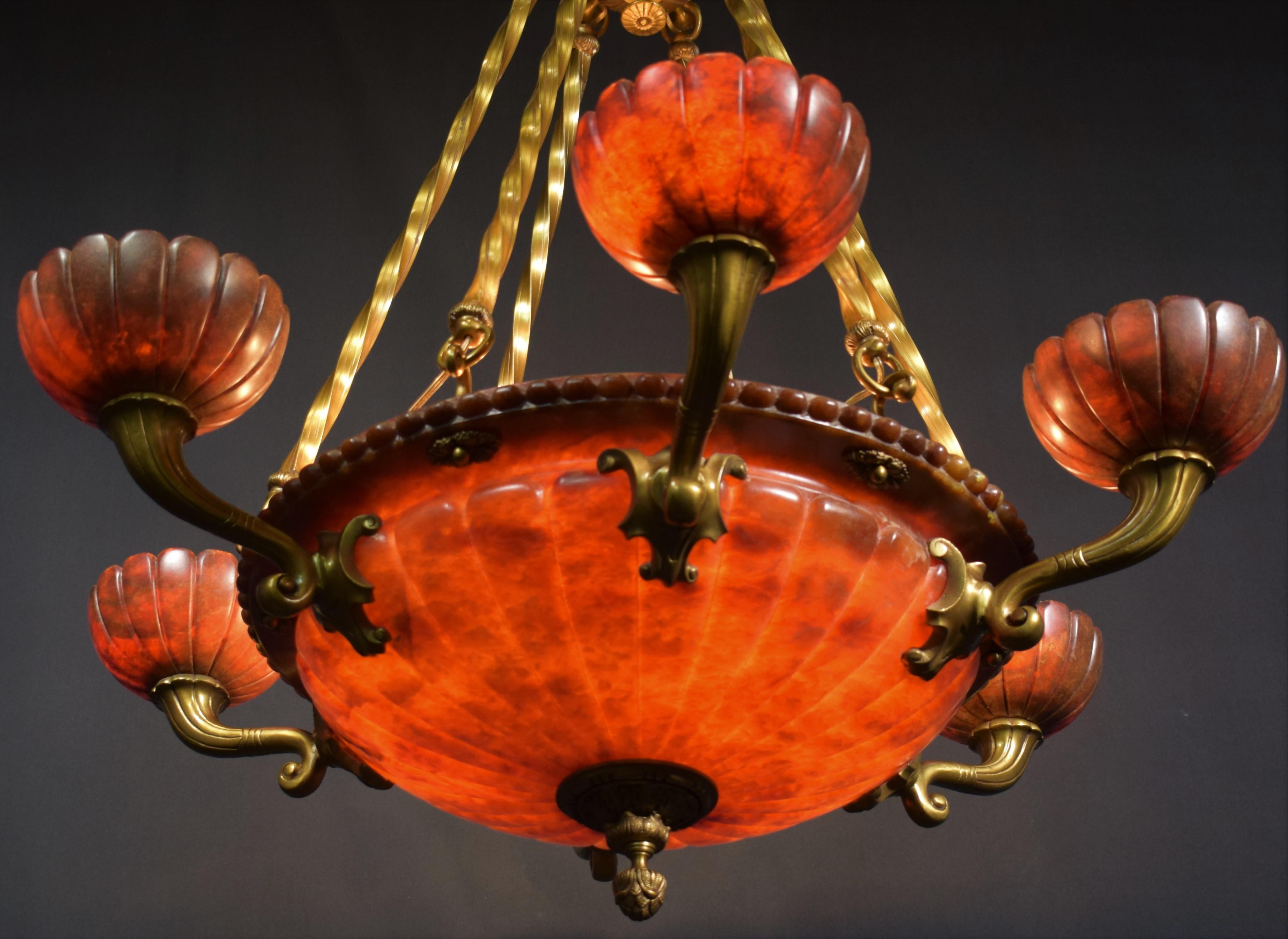 Alabaster chandelier. 9 lights (6 outside & 3 inside dome). 
France, circa 1920
Dimensions: Height 47