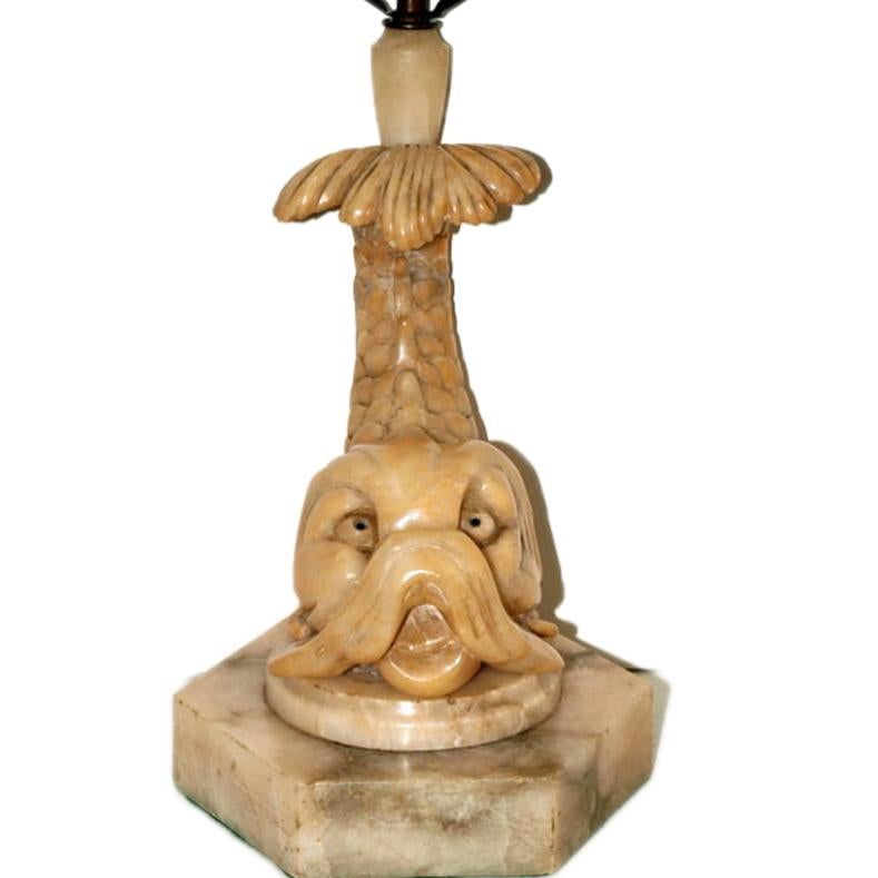 A single circa 1930s Italian carved alabaster table lamp shaped as dolphin.

Measurements:
Height of body: 16