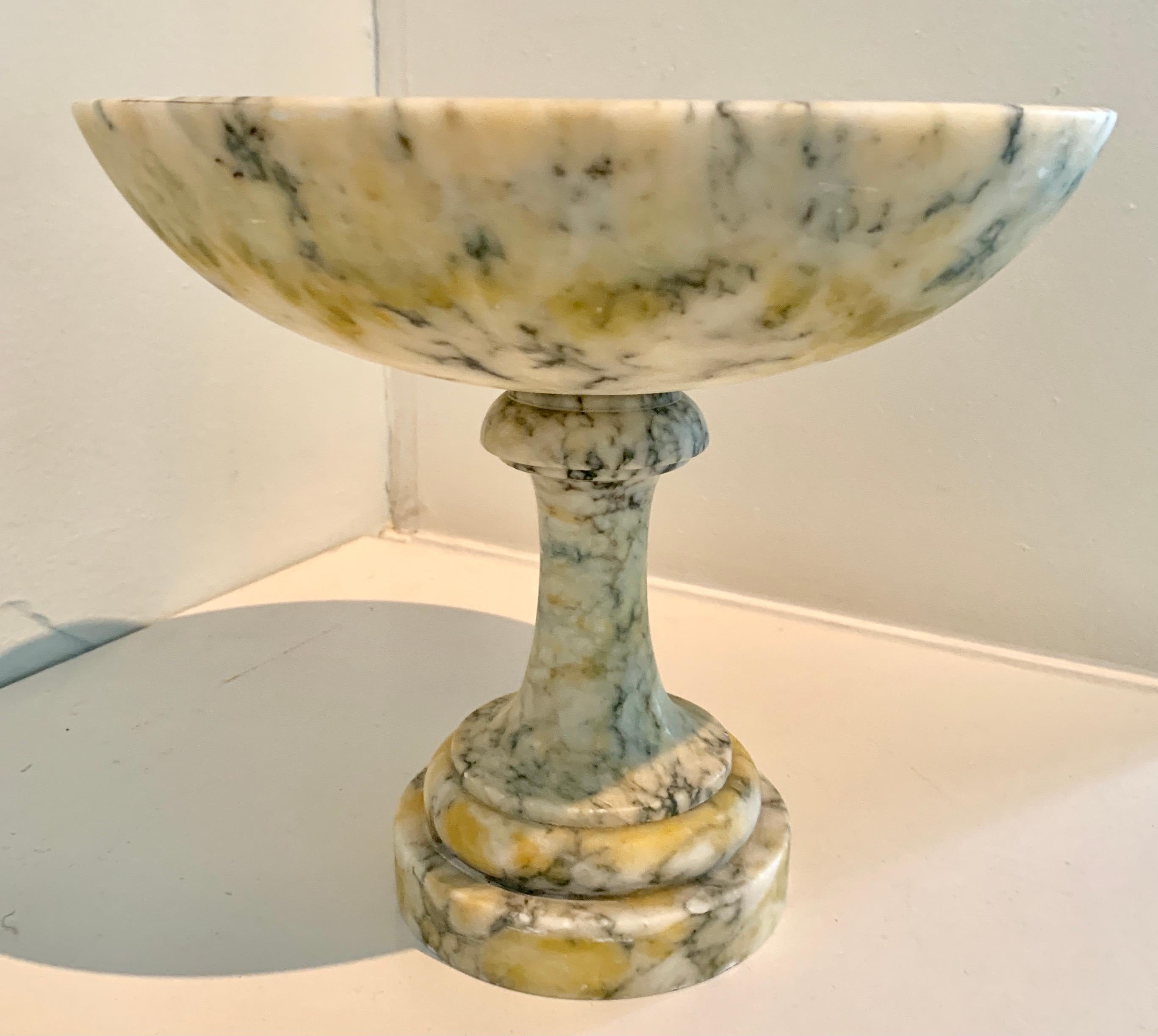 Marble or Alabaster footed compote. A handsome piece and perfectly suited for the kitchen, den or dining room, as a fruit bowl, center piece or purely decorative. A stunning and lovely addition.

 
