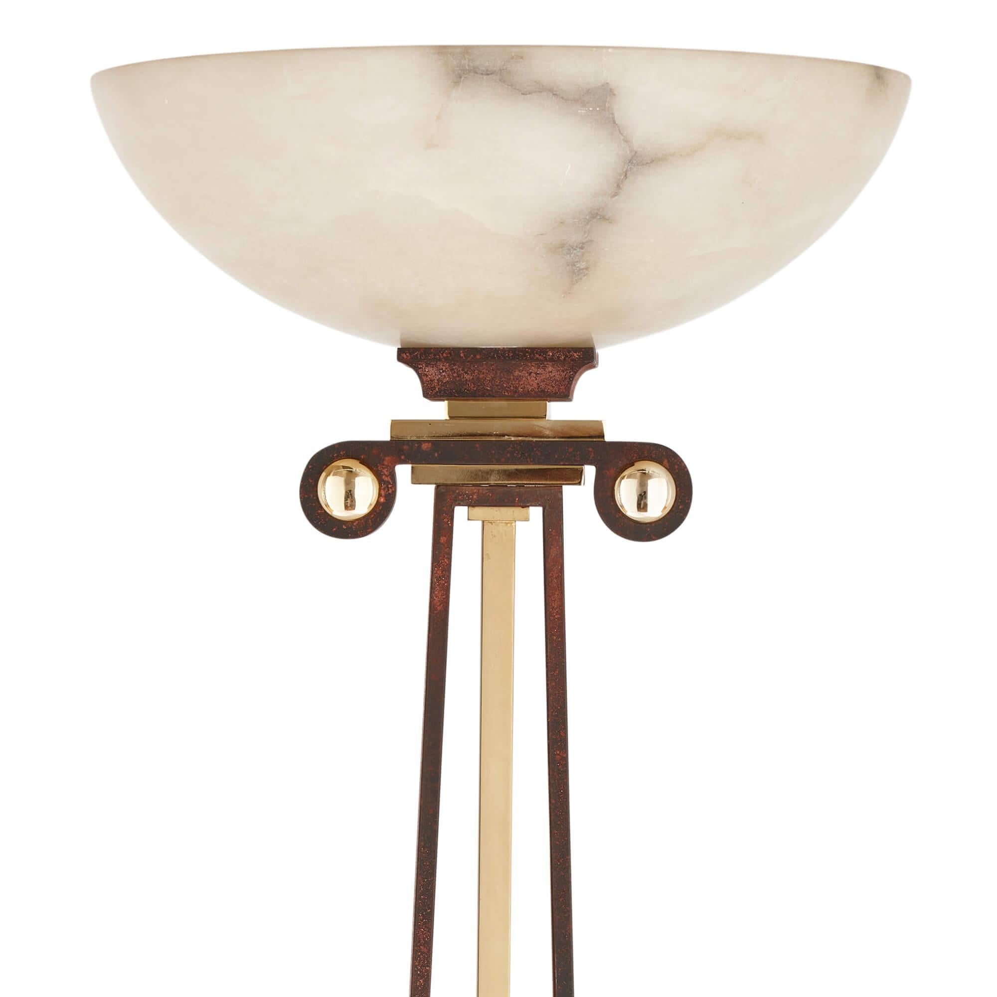 Alabaster, gilt metal and patinated iron floor lamp 
Continental, 20th Century
Height 185cm, diameter 40cm

Inspired by Classical Greek architecture, this modern floor lamp would be a magnificent addition to both contemporary and traditional