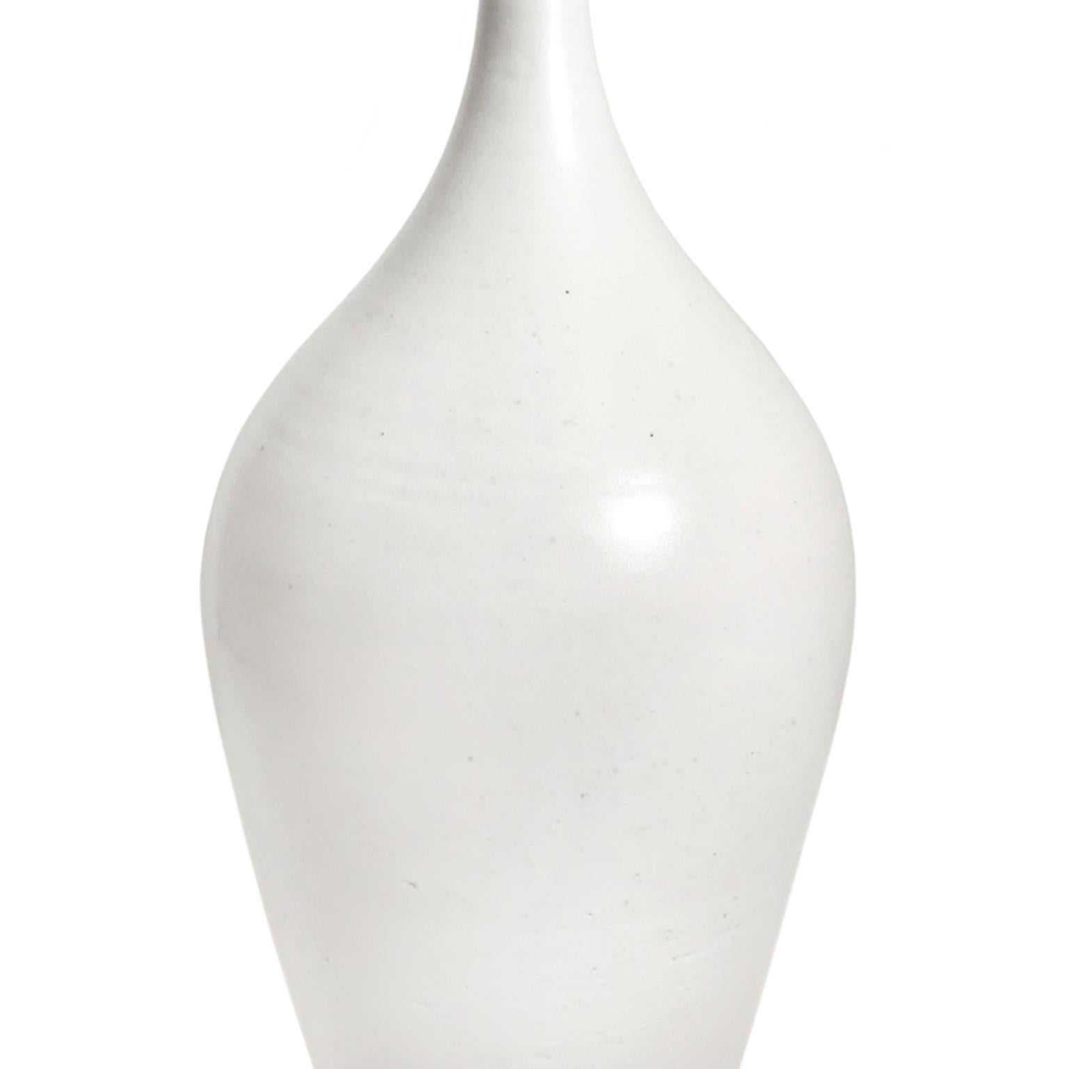 Alabaster glaze ceramic bottle #3 by Sandi Fellman, 2018. 

Veteran photographer Sandi Fellman's ceramic vessels are an exploration of a new medium. The forms, palettes, and sensuality of her photos can be found within each piece. The tactile