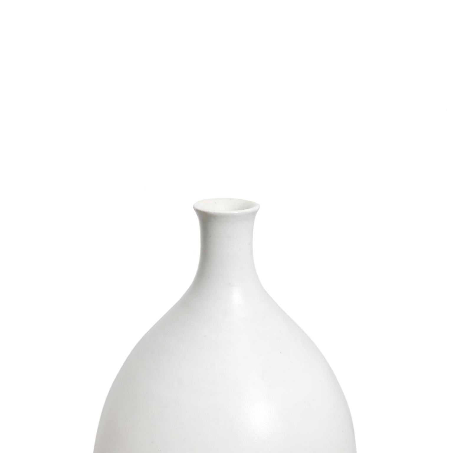 Alabaster glaze ceramic bottle #7 by Sandi Fellman, 2018. 

Veteran photographer Sandi Fellman's ceramic vessels are an exploration of a new medium. The forms, palettes, and sensuality of her photos can be found within each piece. The tactile