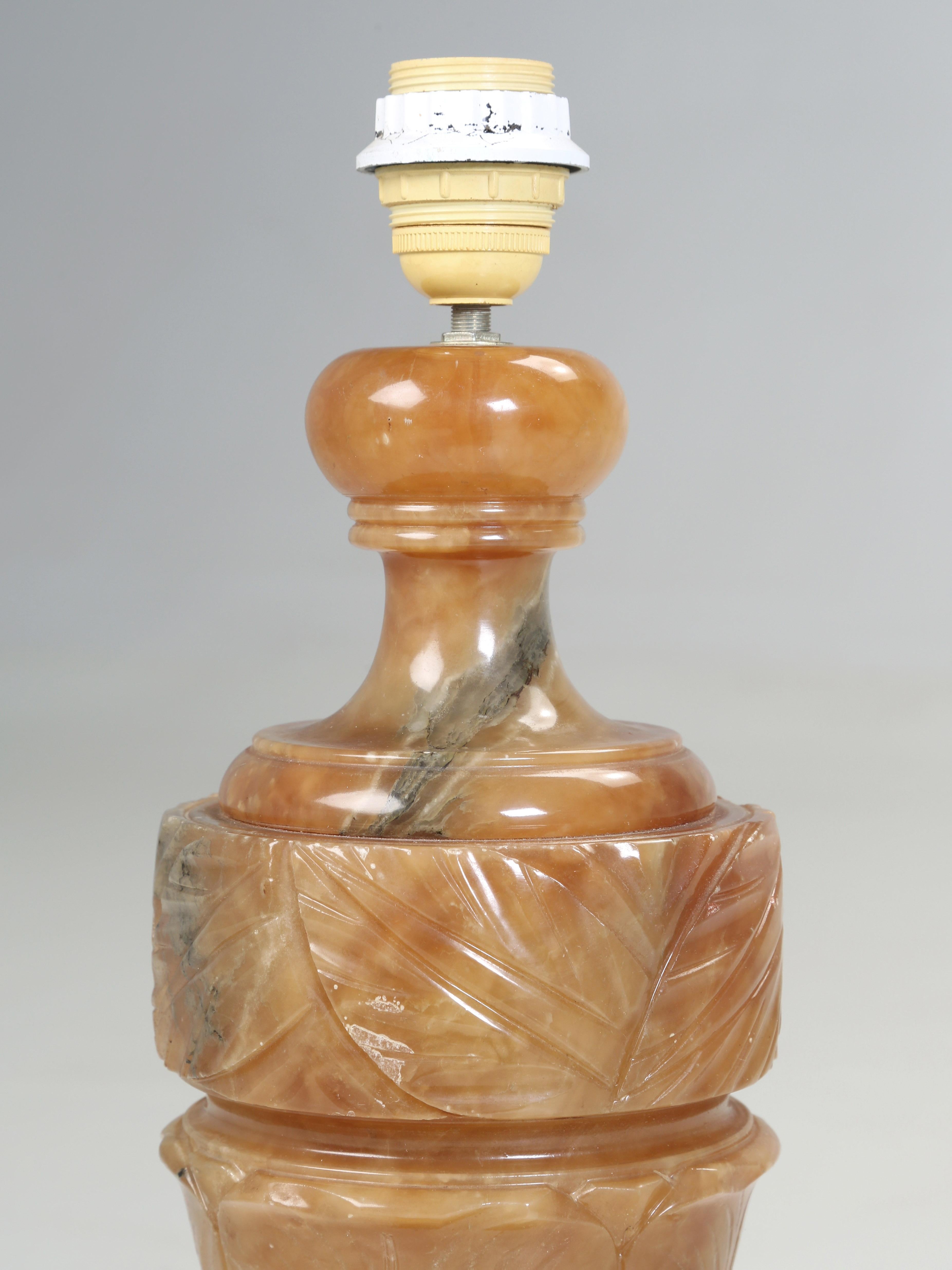 Beautiful Hand-Carved Alabaster Lamp imported from France and does require rewiring for the US.
The stone, Alabaster comes in several colors, although they then to be mostly white, yellow or orange. The mineral is ideal for carving since it is
