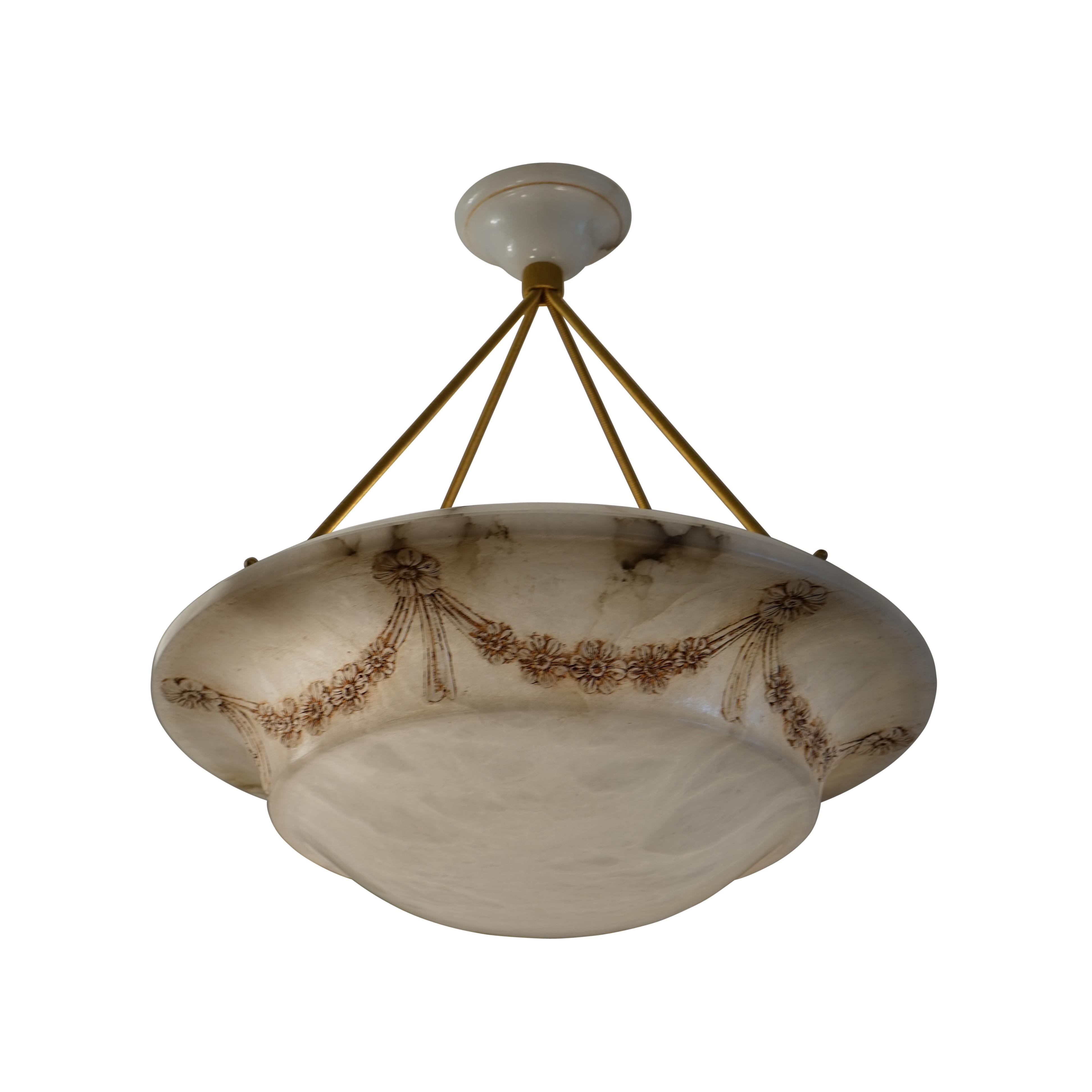 A graceful fixture festooned with garlands and tassels, this fixture was custom designed for a neoclassical residence being retro-fitted for electricity at the turn of the last century.
  