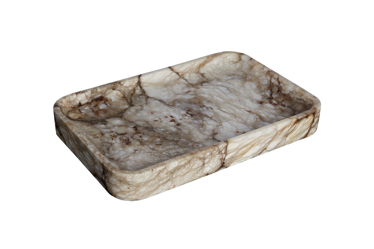 Handcrafted by Isidre Magre, like a ray of light the alabaster tray is a warm companion spot in the room. One where you can also leave your book, your pen, your glass of wine.

Made of alabaster from El Sarral, Tarragona, a unique quarry, the only