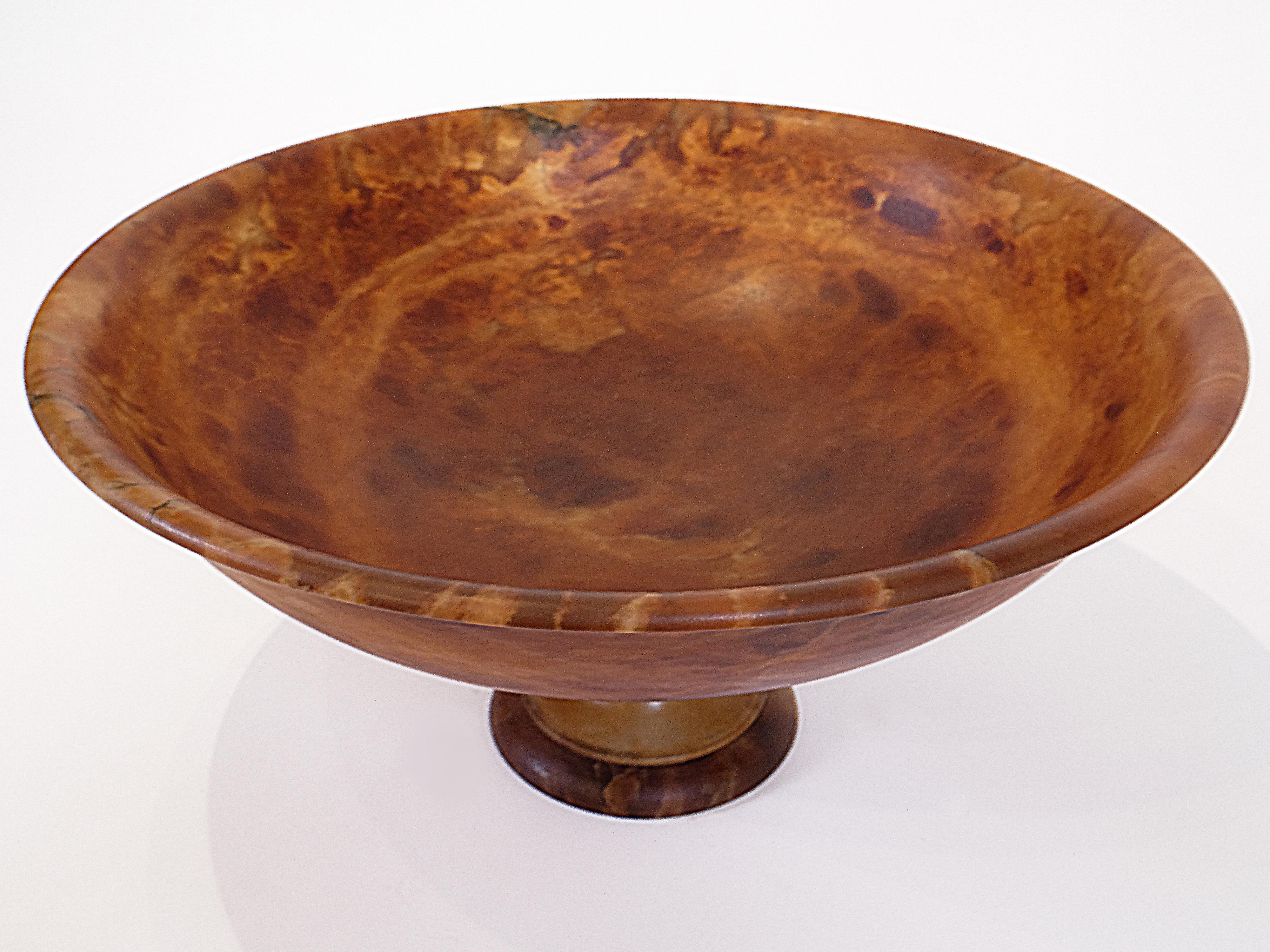 Offered is an amber-colored chiseled alabaster pedestal bowl designed exclusively for Urban Art Home and made by an artisan in Italy. 

The bowl measures 23