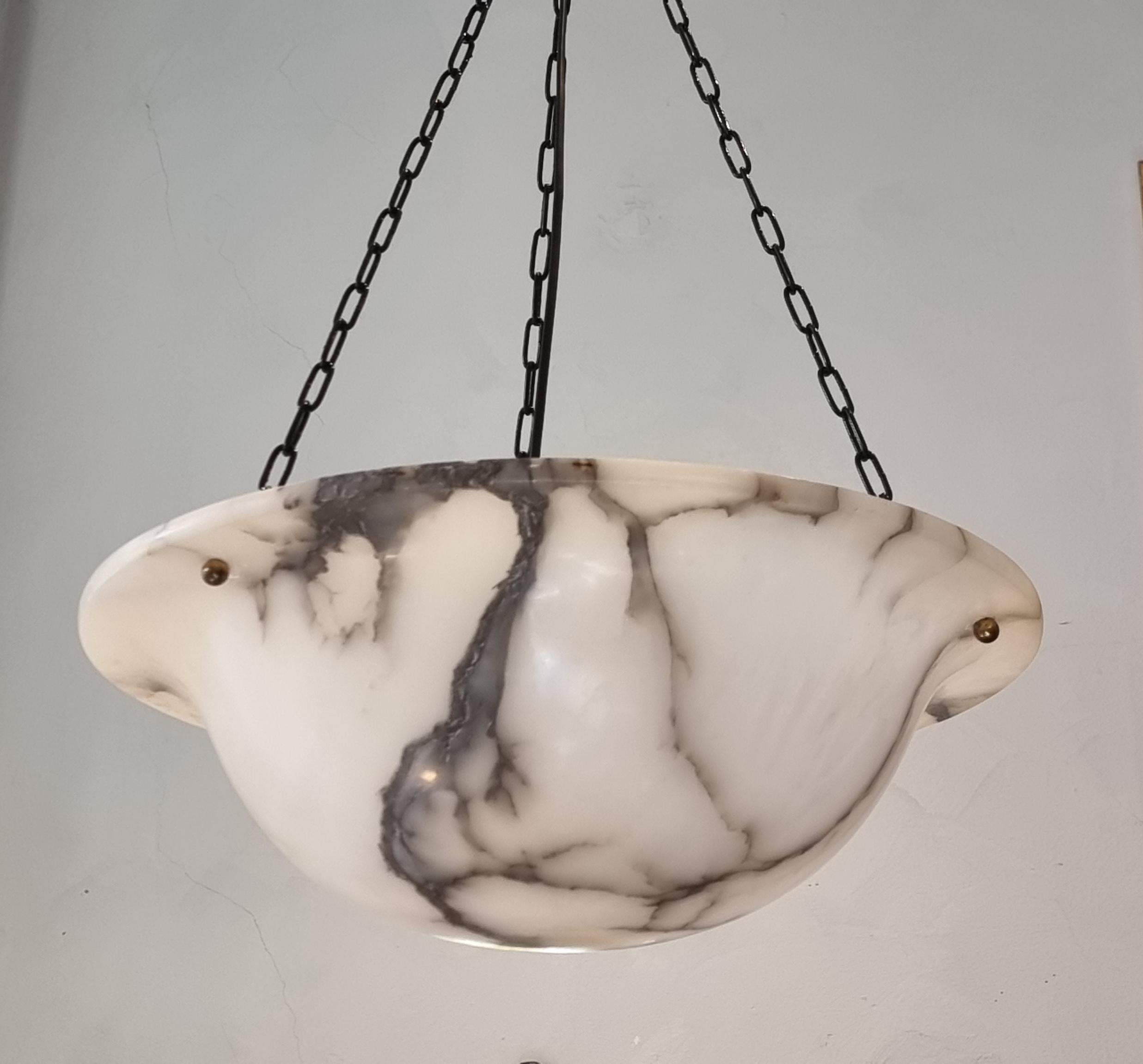 A beautiful pendant in alabaster with new wiring and black chains. Similar has been made by Bröderna Malmströms metallvarufabrik (BM) in Sweden during the early 1900s. 

A beautiful detail in any interior, the alabster makes the light spread softly