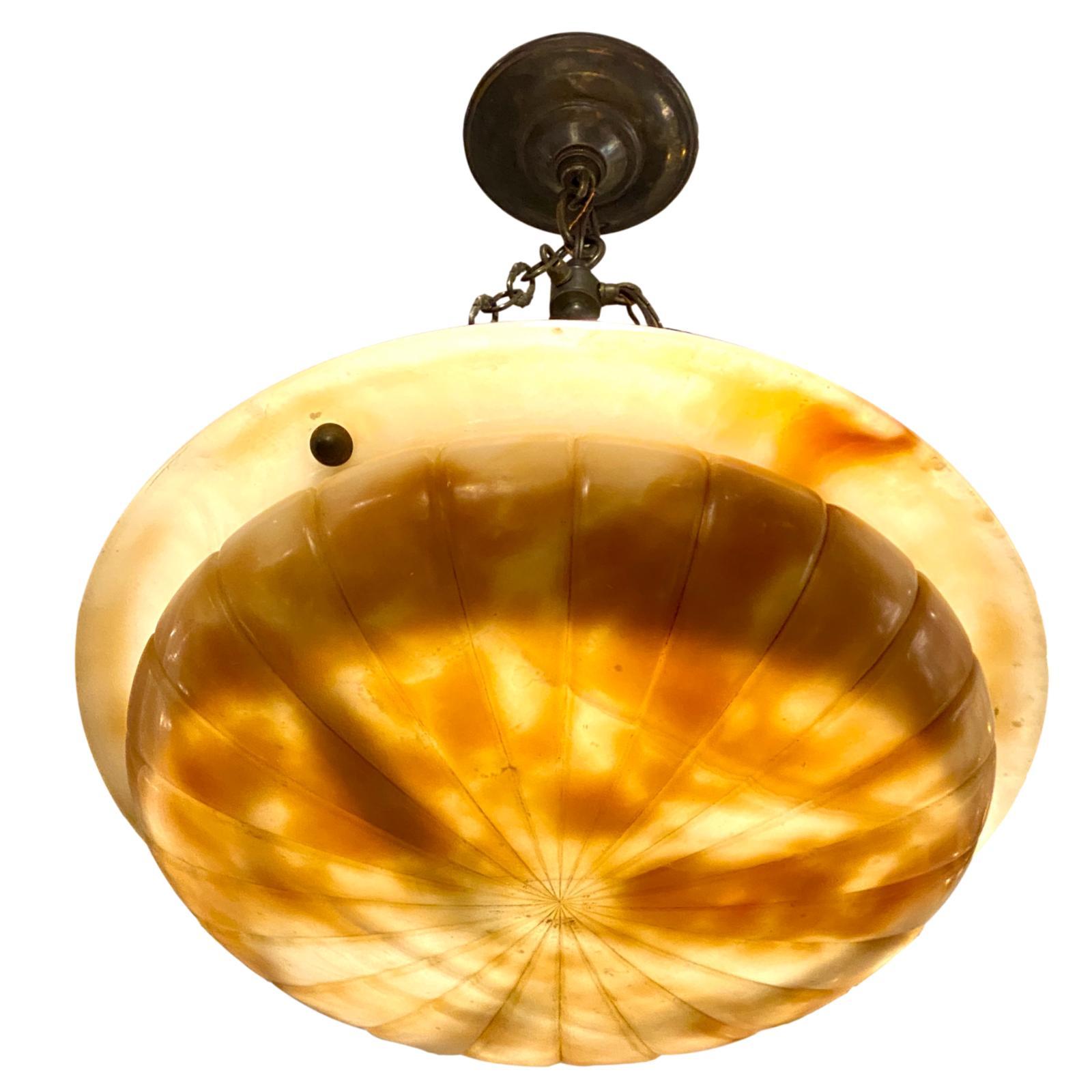 A circa 1930s Italian carved alabaster pendant light fixture with patinated bronze fittings.

Measurements:
Drop 22