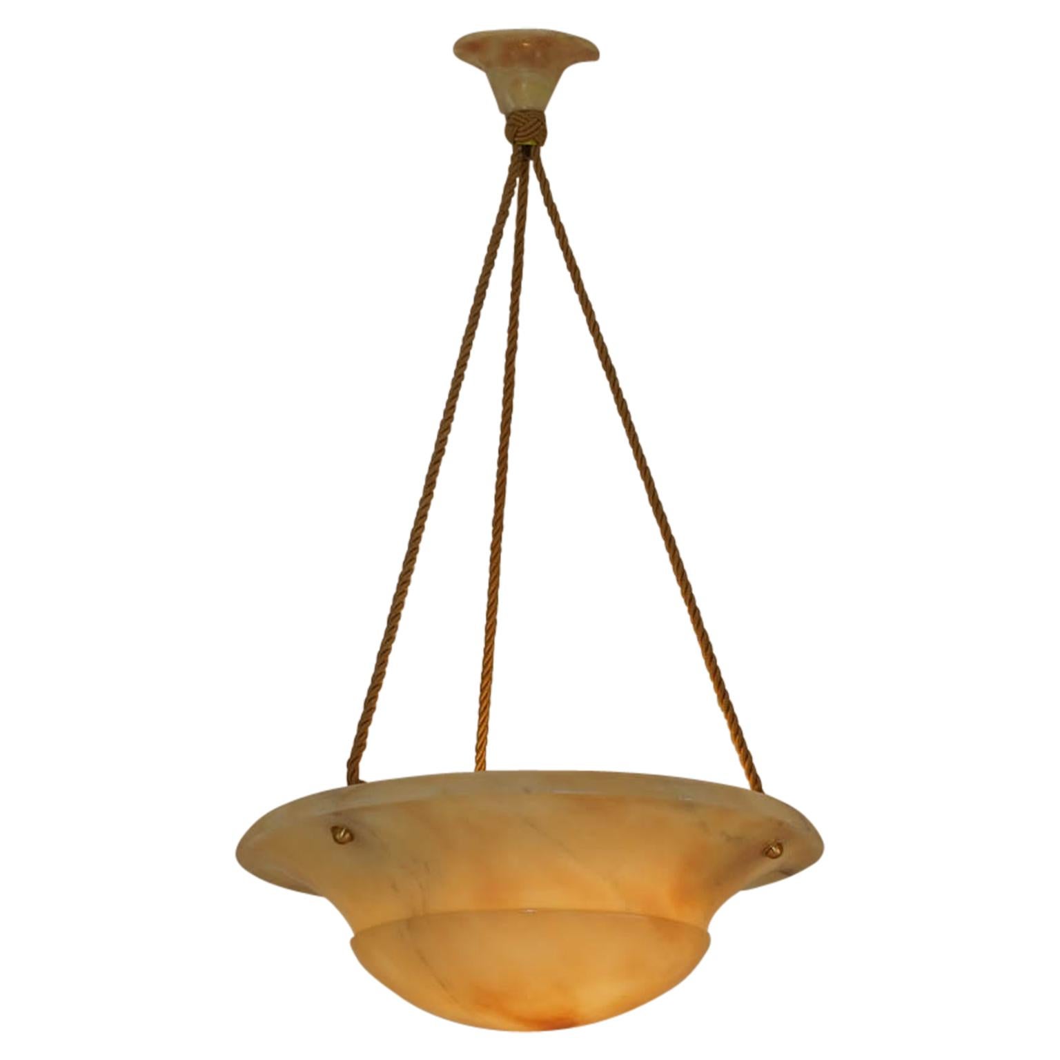 This unusual colored alabaster stone hints of citrus tones of lemon, tangerine, and of peach. Recently rewired on a set of three electrified ropes, the fixture holds three 60 watt incandescent bulbs or any wattage LED bulbs. Custom drop available at