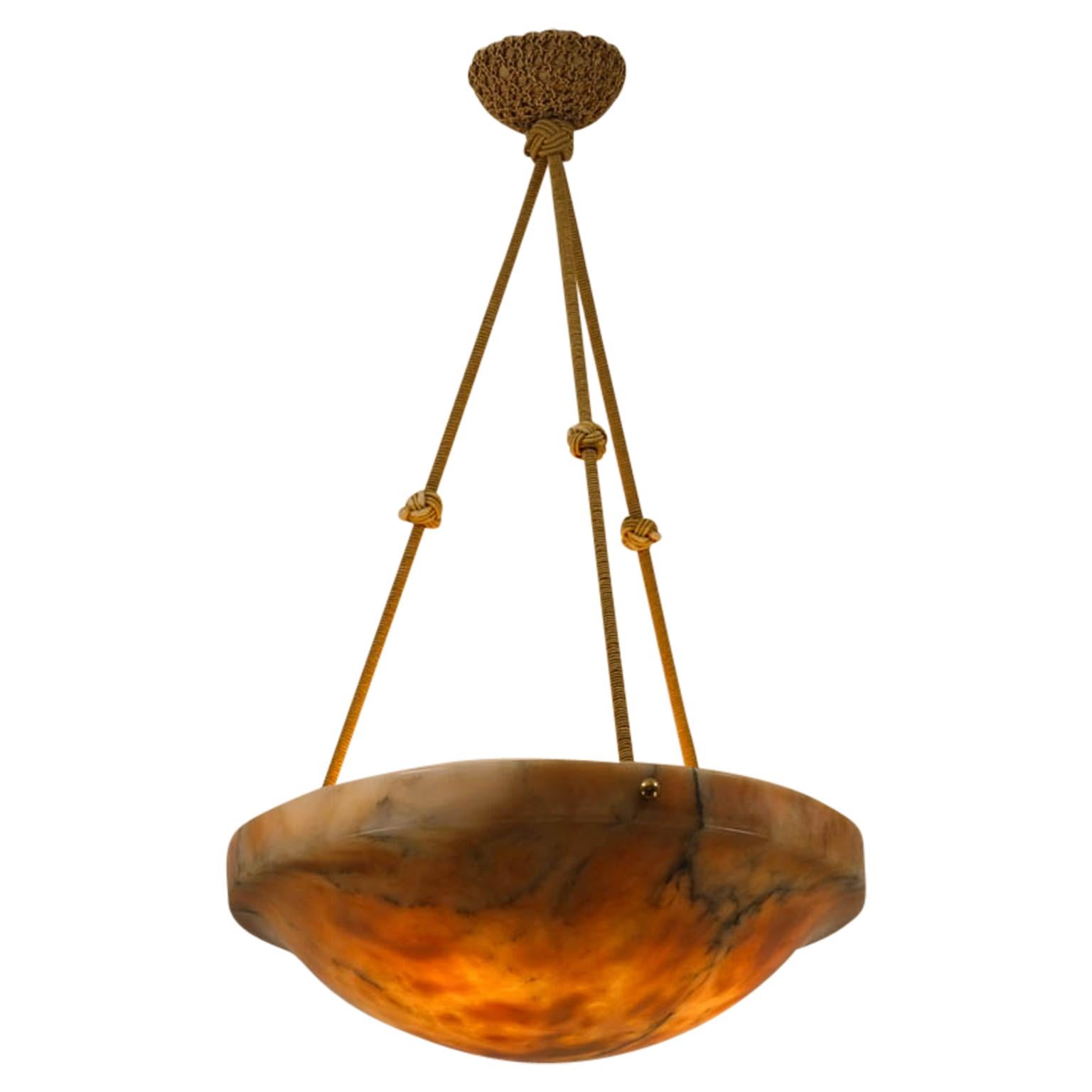With a confident upper rim, this carved shade diffuses light through an elegant bowl. Perfectly proportioned.