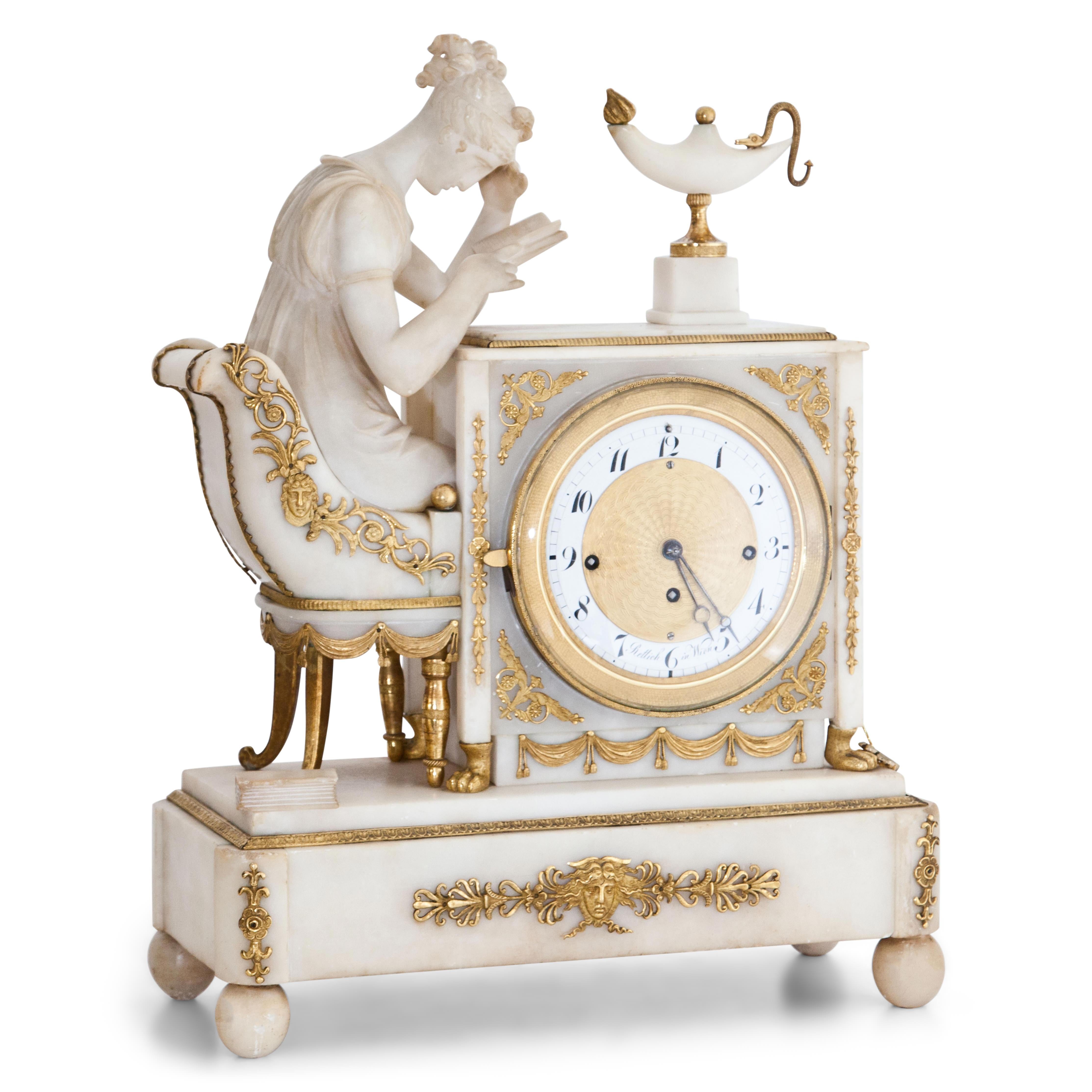 Alabaster Pendule clock standing on ball feet with fire-gilded bronze fittings. The rectangular base shows a figurative representation of young woman, reading in the light of an oil lamp. Inscriped in the open book 