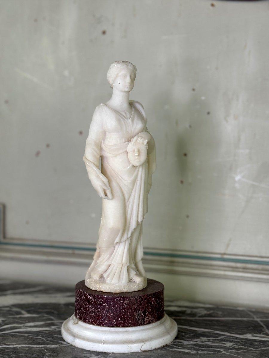 Woman with mask, alabaster sculpture in the style of the antique on a porphyry and white Carrara marble base