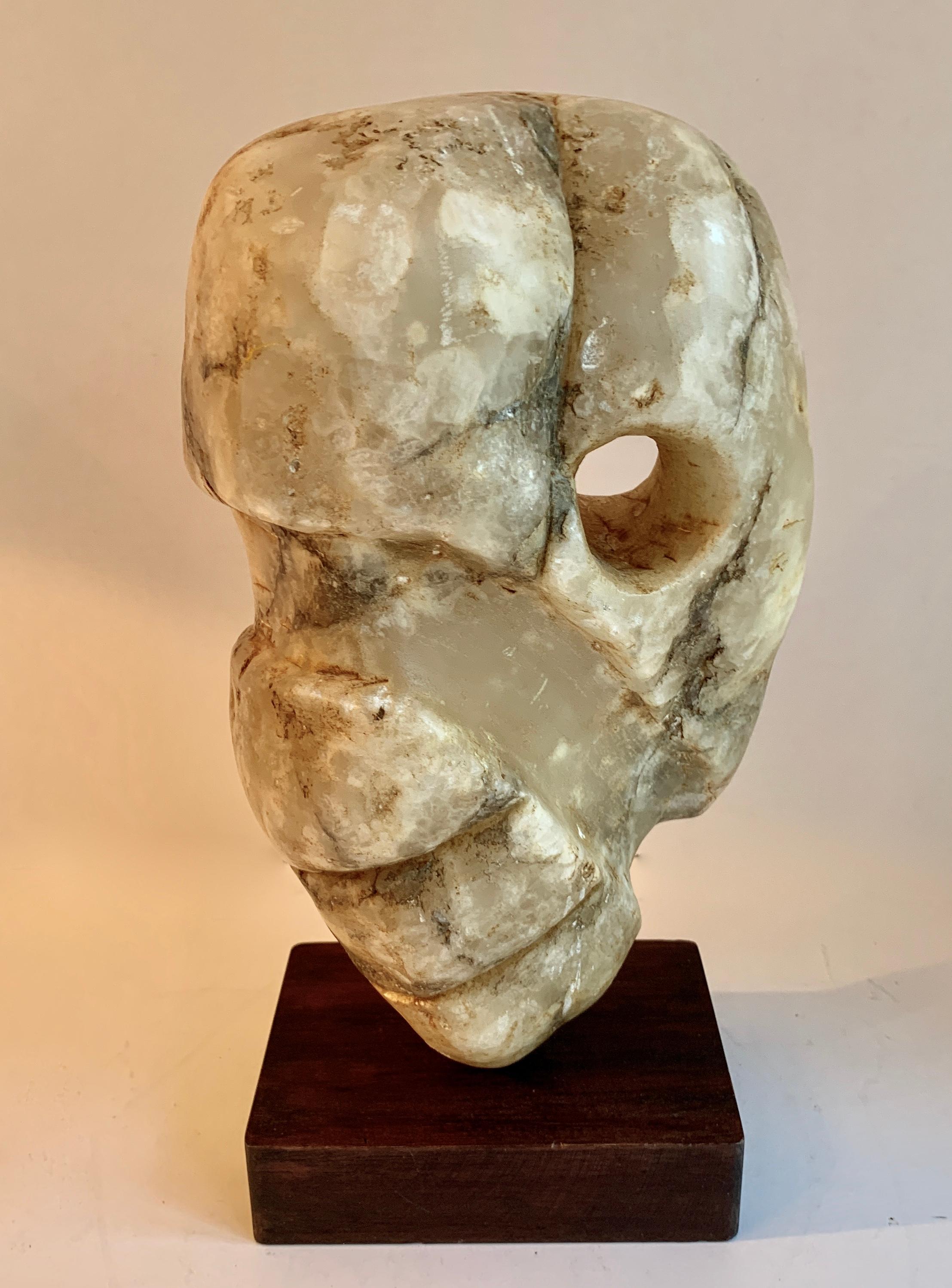 An Alabaster sculpture on wooden stand. Vintage stone sculpture of alabaster - a compliment to most rooms, on a pedestal or shelf. Mixture of modern or in a traditional setting. Hand carved with a wonderful shape and hole bore.