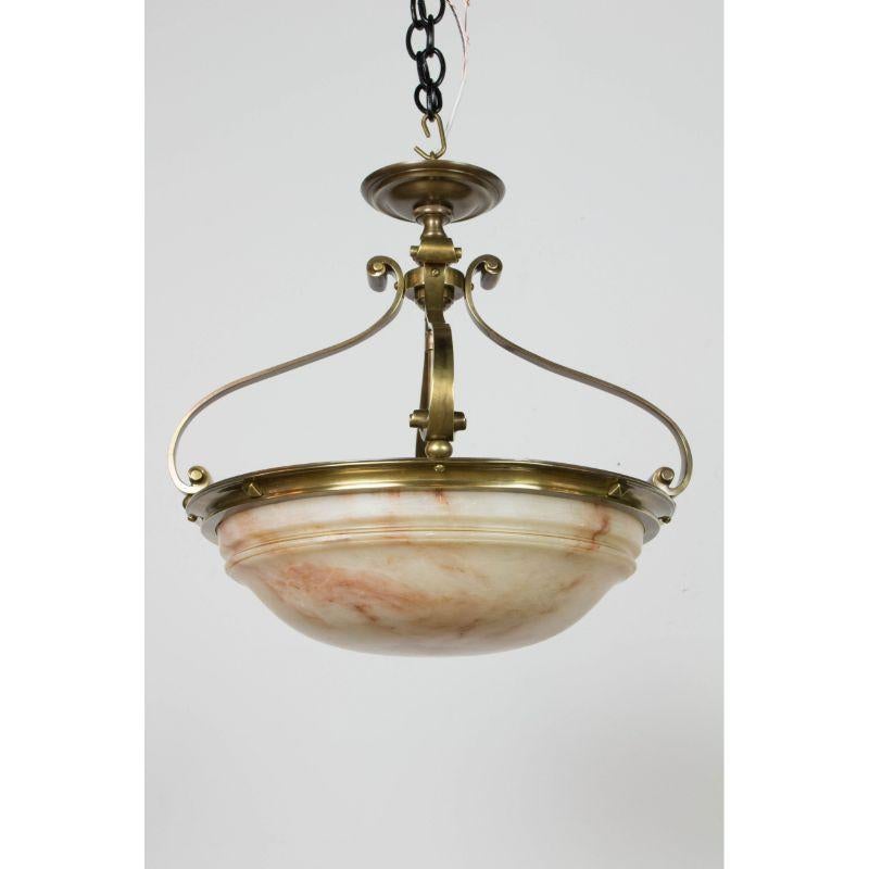 Alabaster Semi Flush 18? bowl. Solid bronze fixture with Alabaster bowl, and three light cluster. Scroll form arms. Alabaster has reddish banding. It has been polished and has some minor scratches as pictured, but no burn marks. C. 1910. Completely