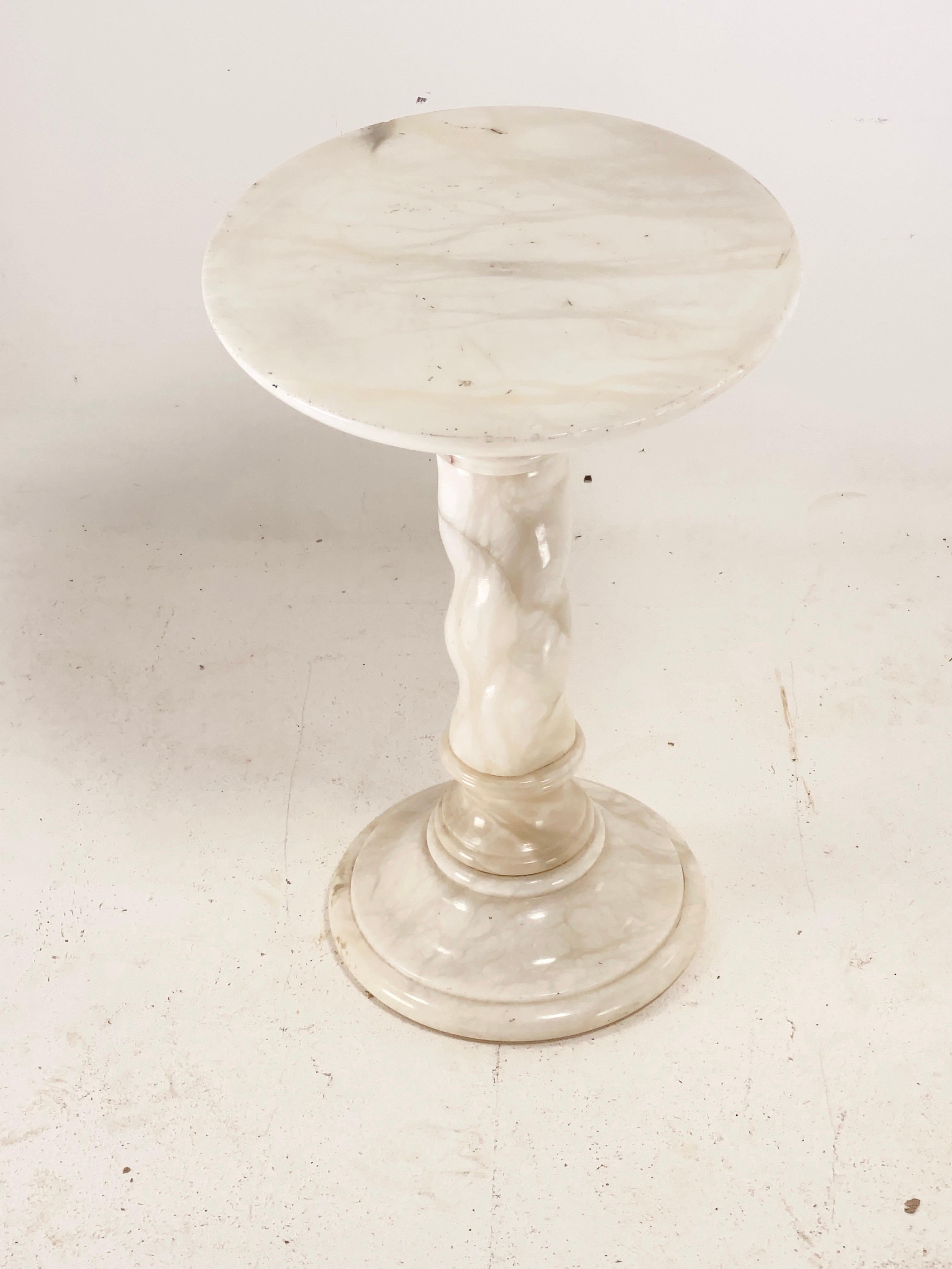 This table is from Italy, and has been probably made in the 1960. It could be used as well as a gueridon or a side table.
It is in a good condition. The axis of the table is tossed. And the foot is fat-claw-like, as in Roman times.