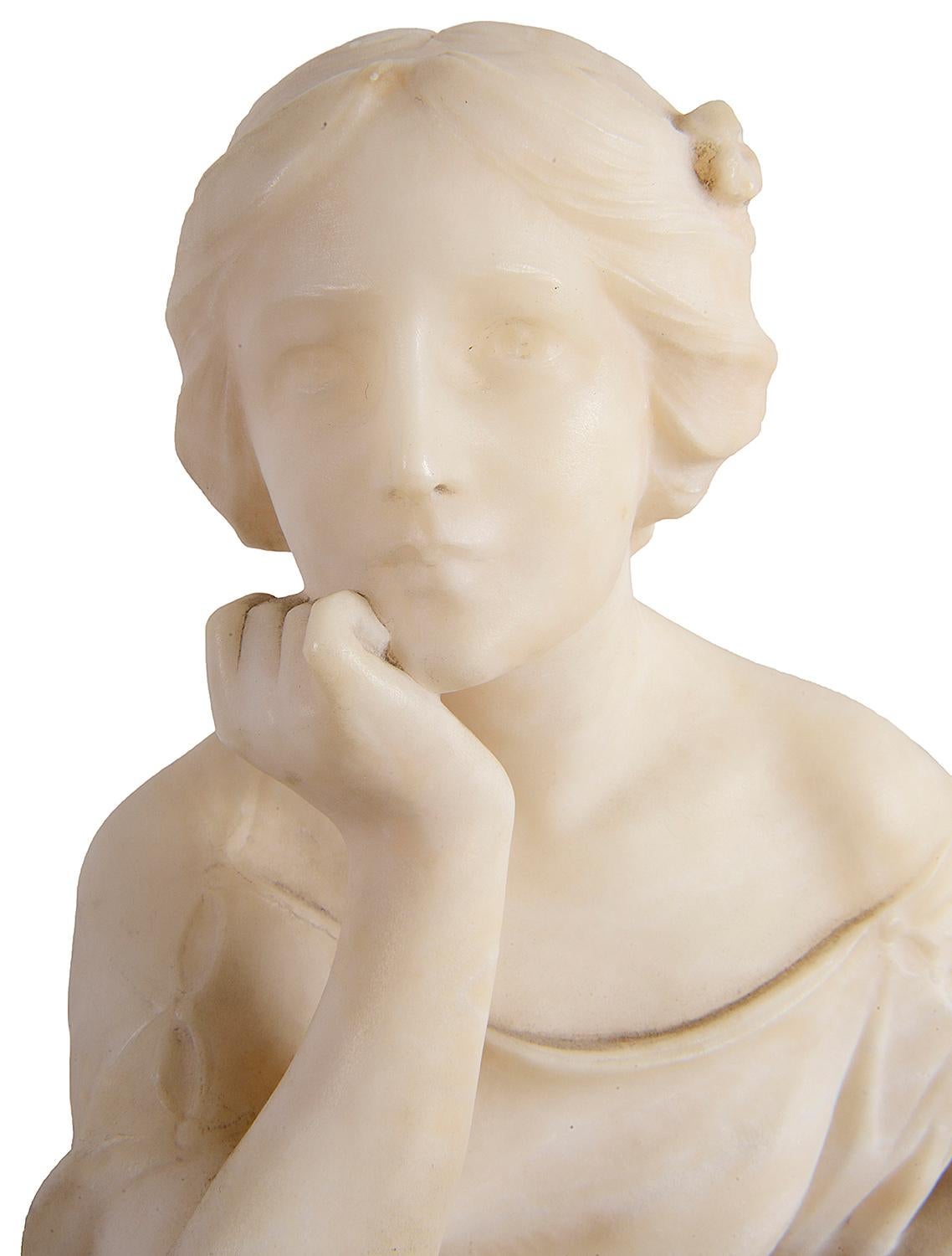 An enchanting 19th century carved alabaster statue of a young girl seated resting her chin. Size: 17.5